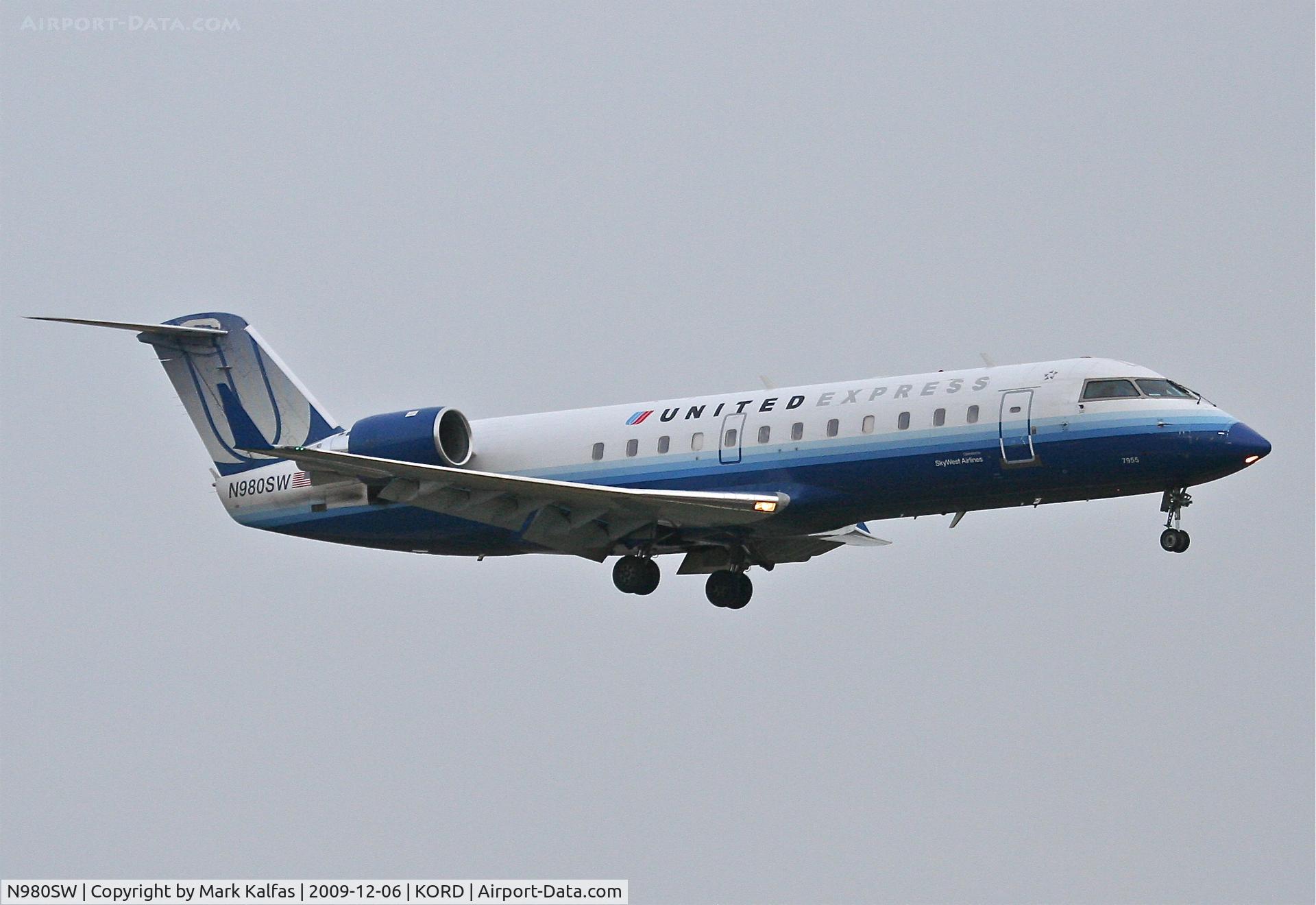 N980SW, 2004 Bombardier CRJ-200ER (CL-600-2B19) C/N 7955, SkyWest Airlines Bombardier CL-600-2B19, SKW6090 arriving from KMLI on 22R.