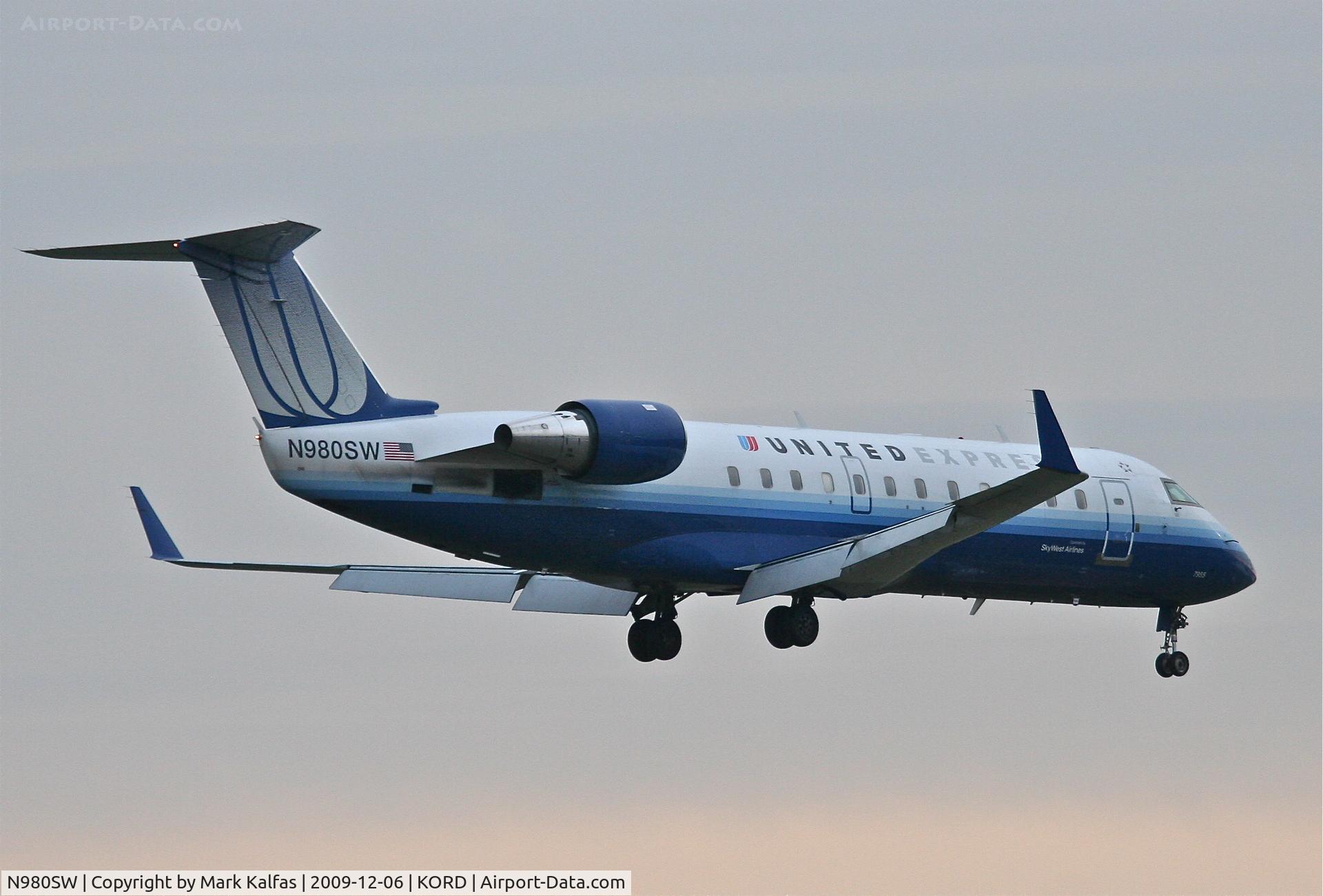N980SW, 2004 Bombardier CRJ-200ER (CL-600-2B19) C/N 7955, SkyWest Airlines Bombardier CL-600-2B19, SKW6090 arriving from KMLI on 22R.