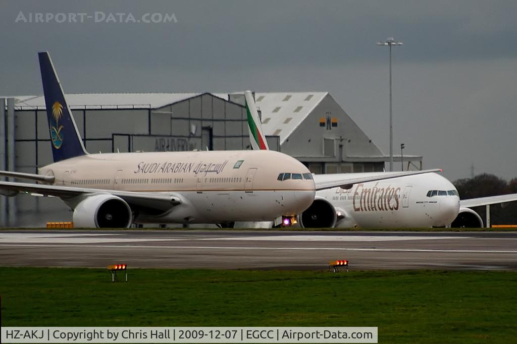 HZ-AKJ, 1998 Boeing 777-268/ER C/N 28353, taxiing out followed by A6-EBX Emirates Boeing 777-31HER