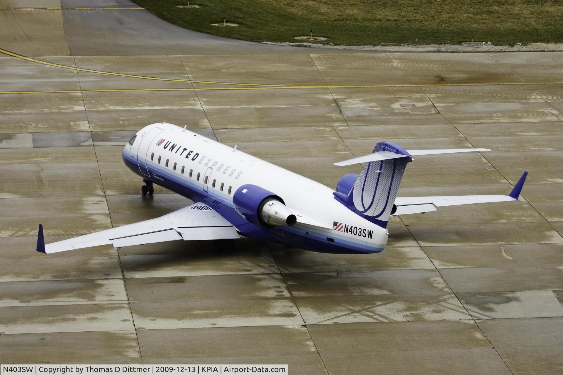 N403SW, 1993 Canadair CRJ-100LR (CL-600-2B19) C/N 7028, United Express (N403SW) leaving the gate