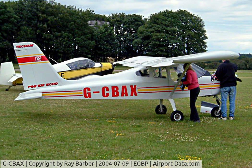 G-CBAX, 2001 Tecnam P-92EM Echo C/N PFA 318-13698, Tecnam P.92-EM Echo [PFA 318-13698] Kemble~G 09/07/2004. Seen at the PFA Fly in 2004 Kemble UK. The pilot is having a tinker with the engine.