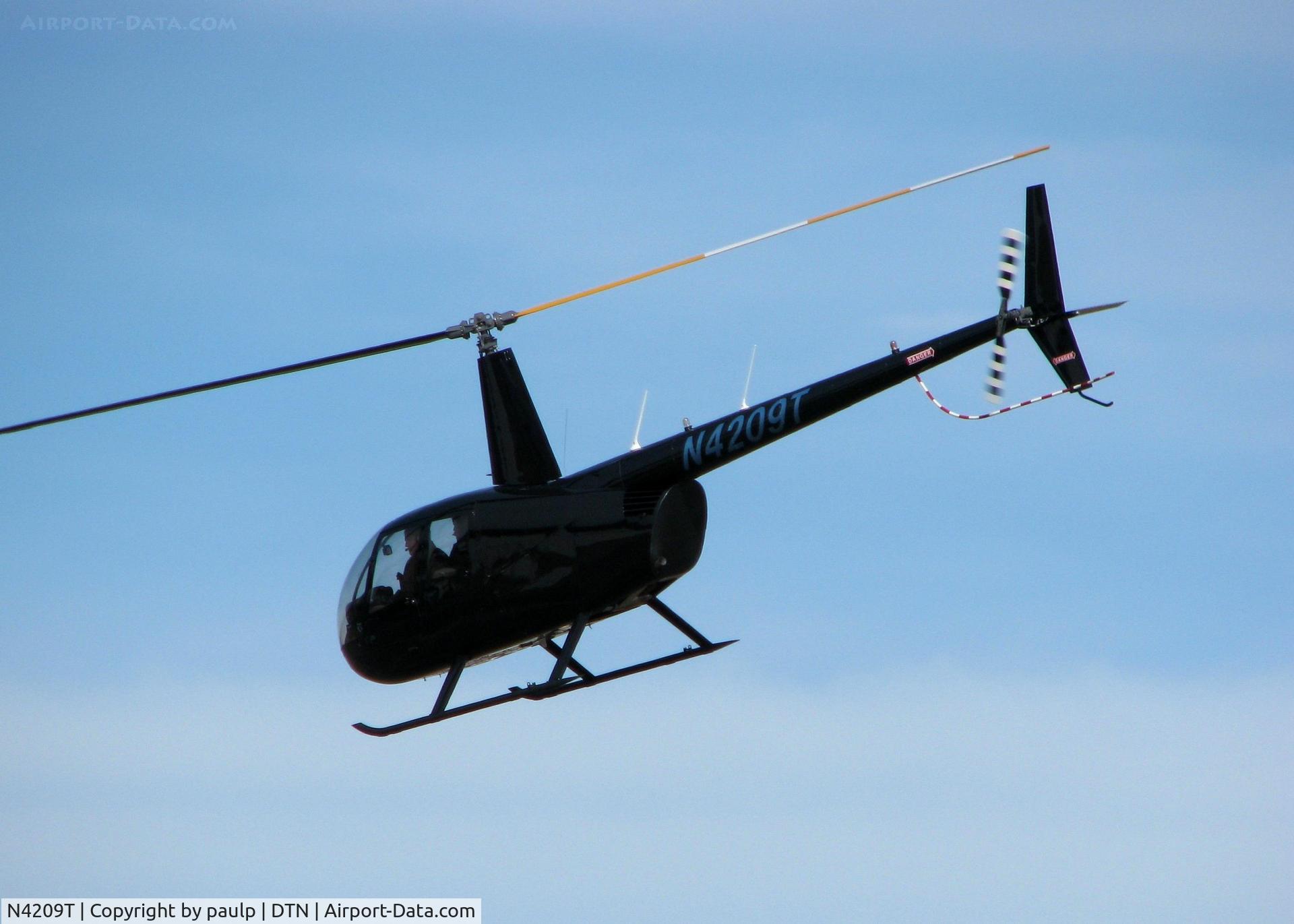 N4209T, 2009 Robinson R44 II C/N 12632, Departing the Shreveport Downtown airport.