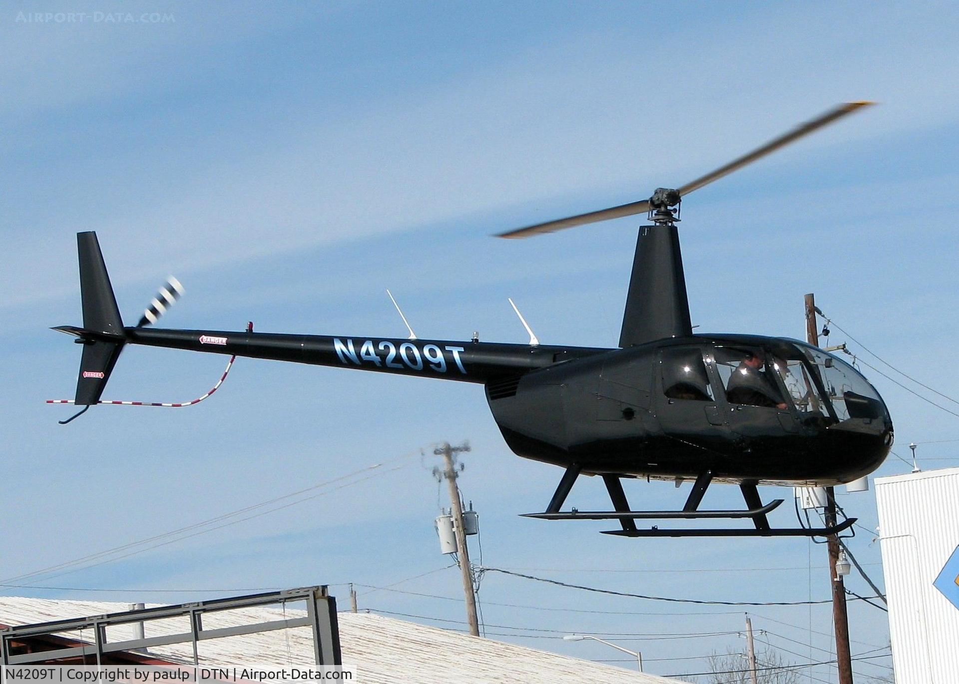 N4209T, 2009 Robinson R44 II C/N 12632, Lifting off from the Shreveport Downtown airport.