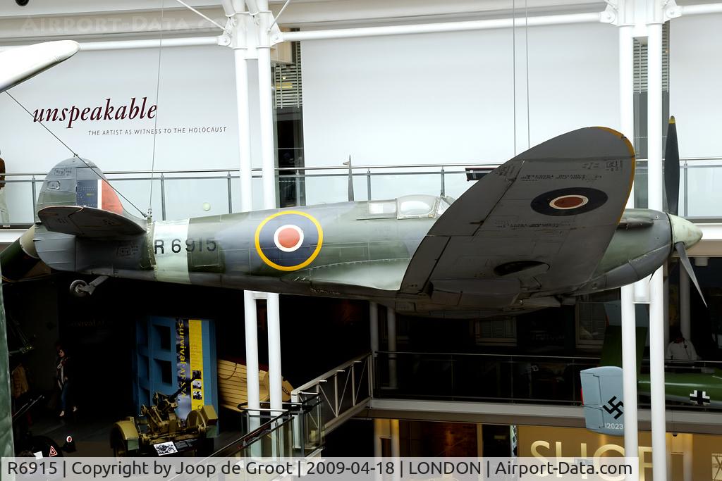 R6915, 1940 Supermarine 300 Spitfire Mk1A C/N 6S/80914, This Spitfire is suspending from the roof of the main entrance hall of the Imperial War Museum.