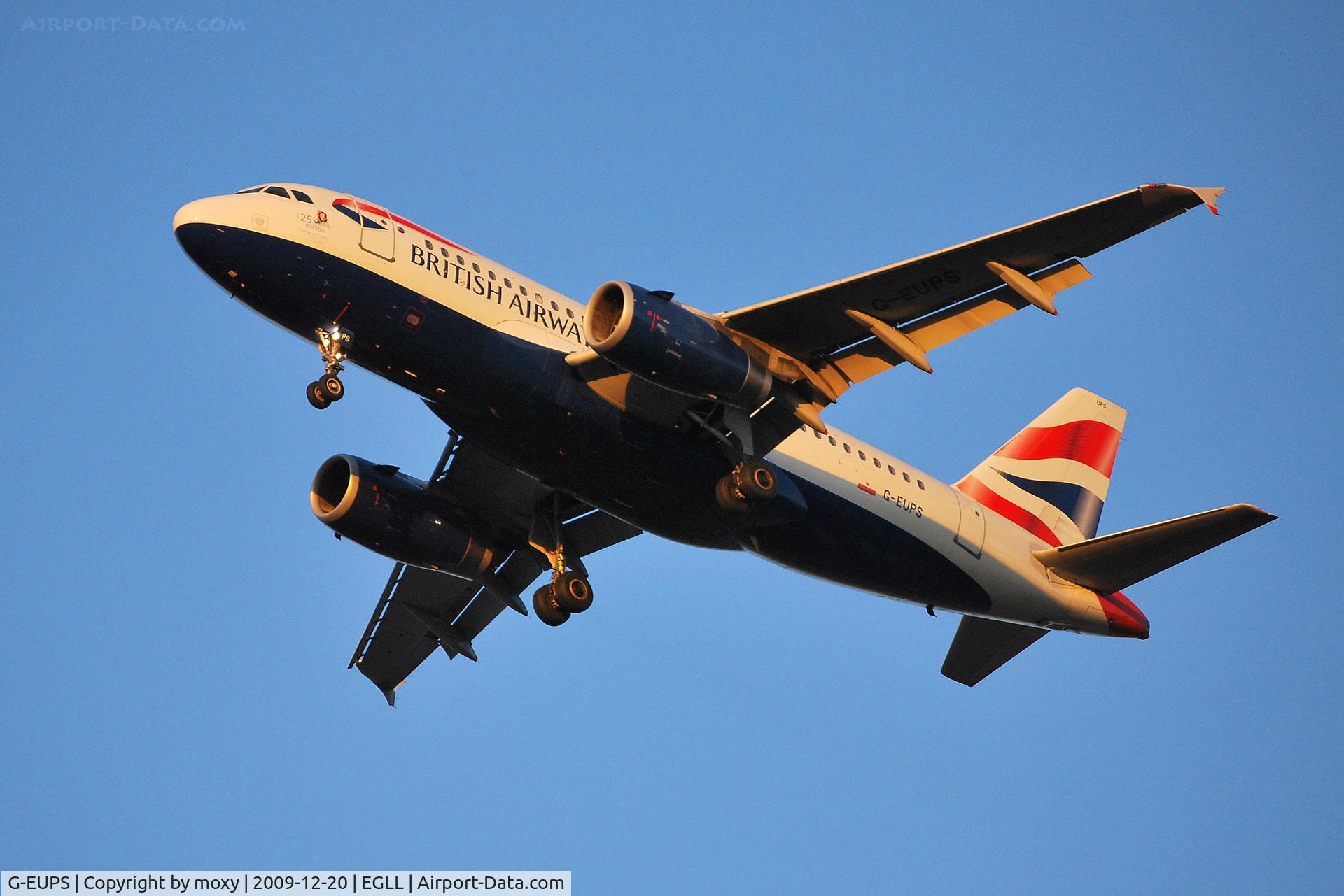 G-EUPS, 2000 Airbus A319-131 C/N 1338, Gear down, flaps down, nearly sun down.