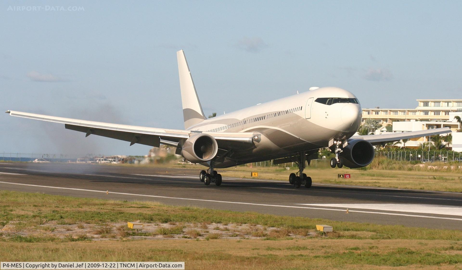 P4-MES, 2003 Boeing 767-33A C/N 33425, P4-MES doing a bounce and go on runway 10 after landing from a long night flight.
