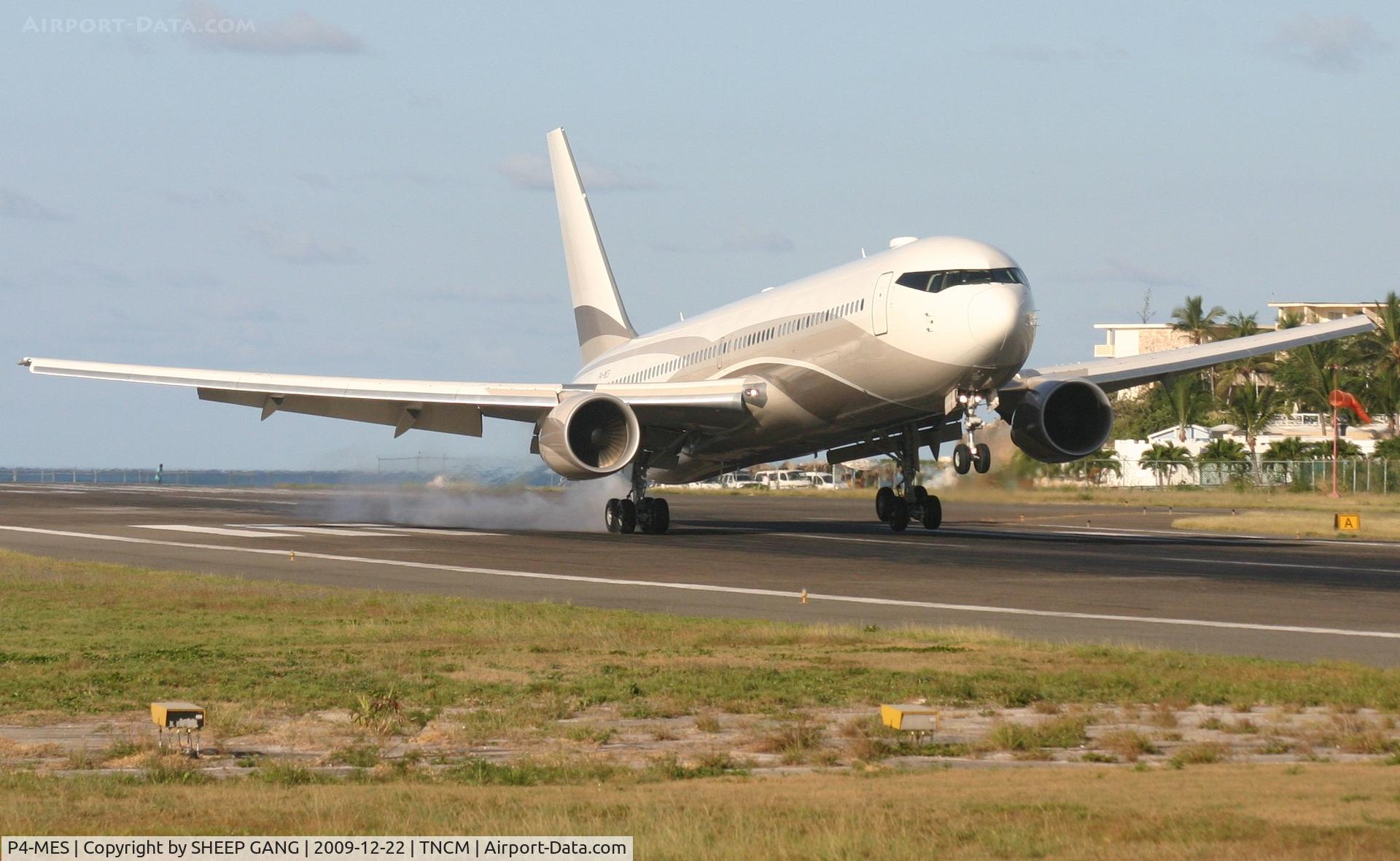 P4-MES, 2003 Boeing 767-33A C/N 33425, P4-MES burning some rubber on a early morning touch down at TNCM