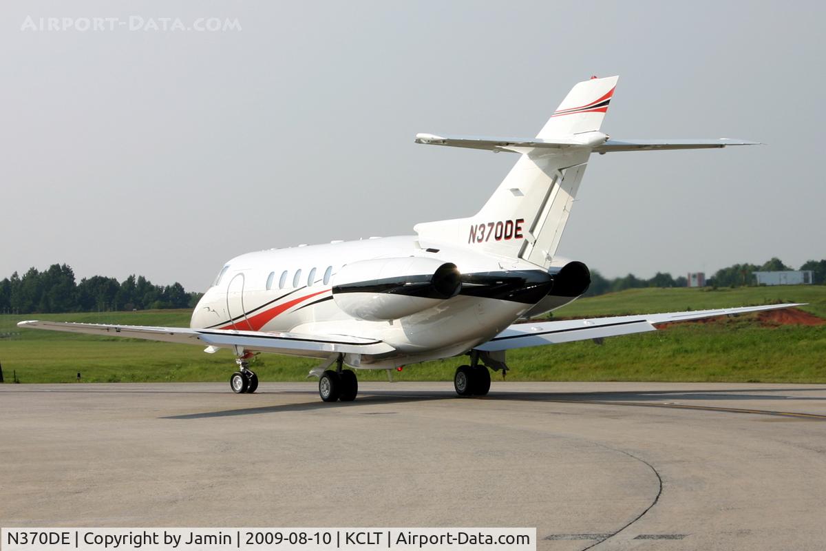 N370DE, 1999 Raytheon Hawker 800XP C/N 258441, In line to depart Runway 18C.  Bad angle, but good light.