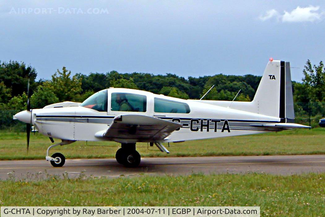 G-CHTA, 1978 Grumman American AA-5A Cheetah C/N AA5A-0631, Grumman American AA-5A Cheetah [AA5A-0631] Kemble~G 11/07/2004. Seen at the PFA Fly in 2004 Kemble UK taxiing out for departure.