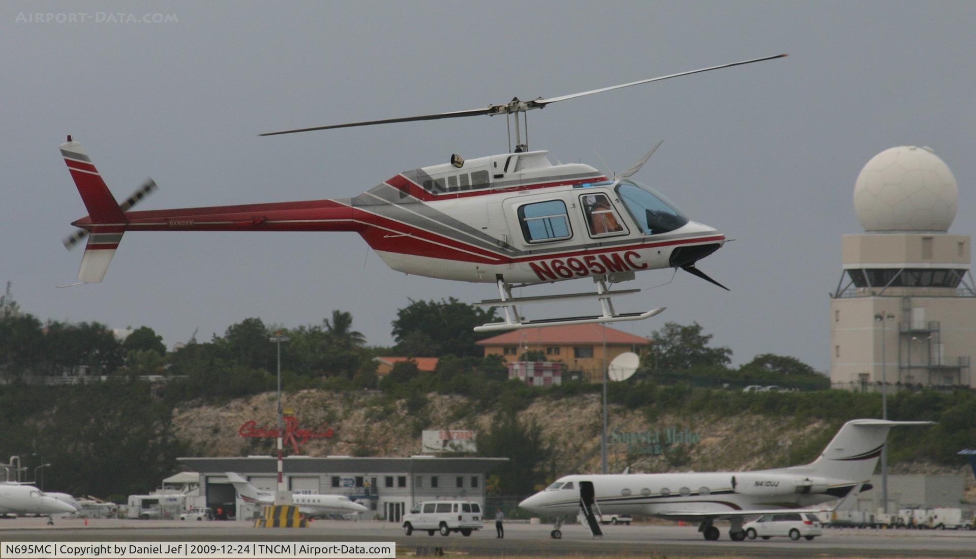 N695MC, 1968 Bell 206B C/N 300, N695MC crossing the main runway for landing at the helipad