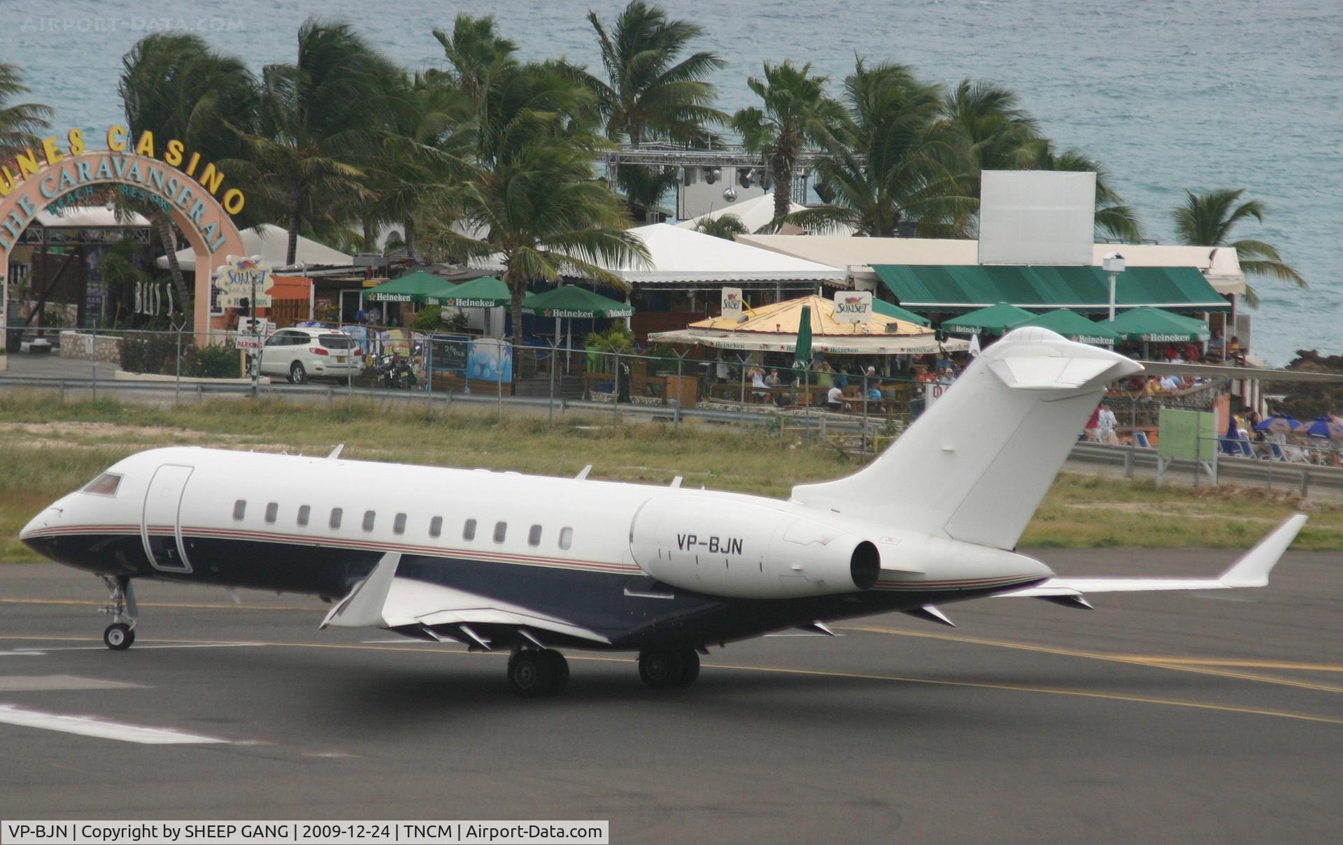 VP-BJN, 2007 Bombardier BD-700-1A11 Global 5000 C/N 9273, VP-BJN at the tresh hold with sunset beach bar in the back ground
