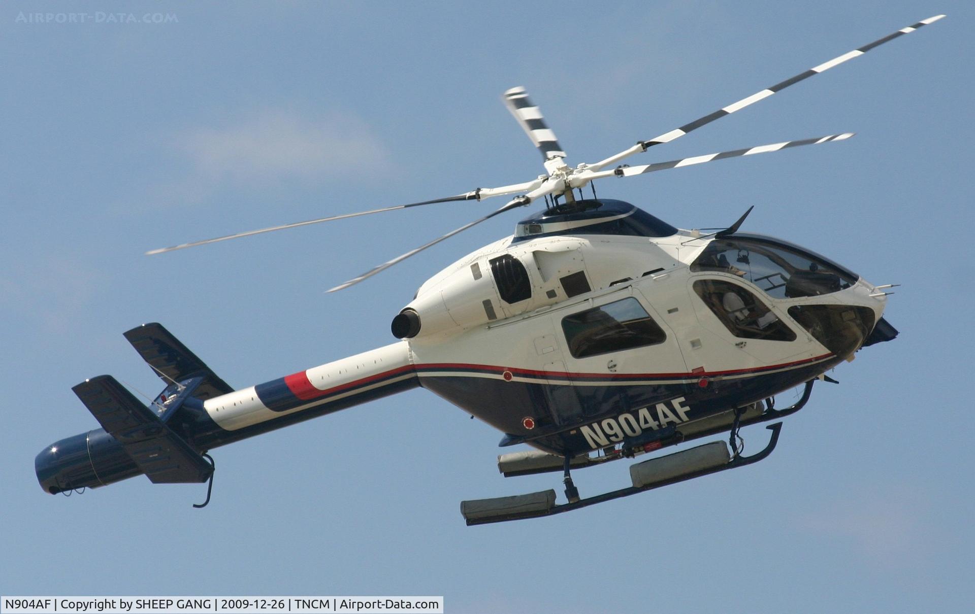 N904AF, 2001 MD Helicopters MD-900 Explorer C/N 900-00101, N904AF crossing the center line of runway 10 for landing at the helipad