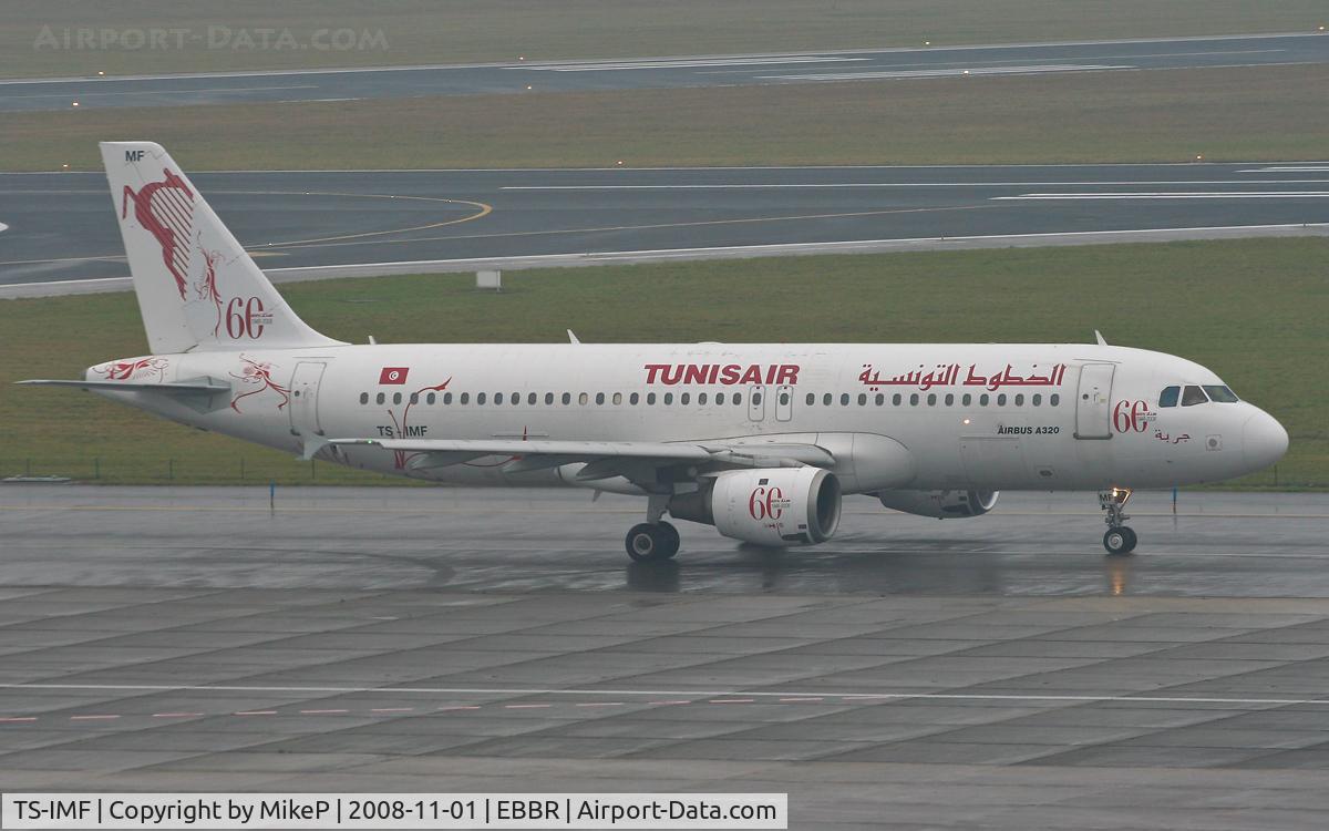 TS-IMF, 1992 Airbus A320-211 C/N 0370, Heading to 07R for departure in the pouring rain.