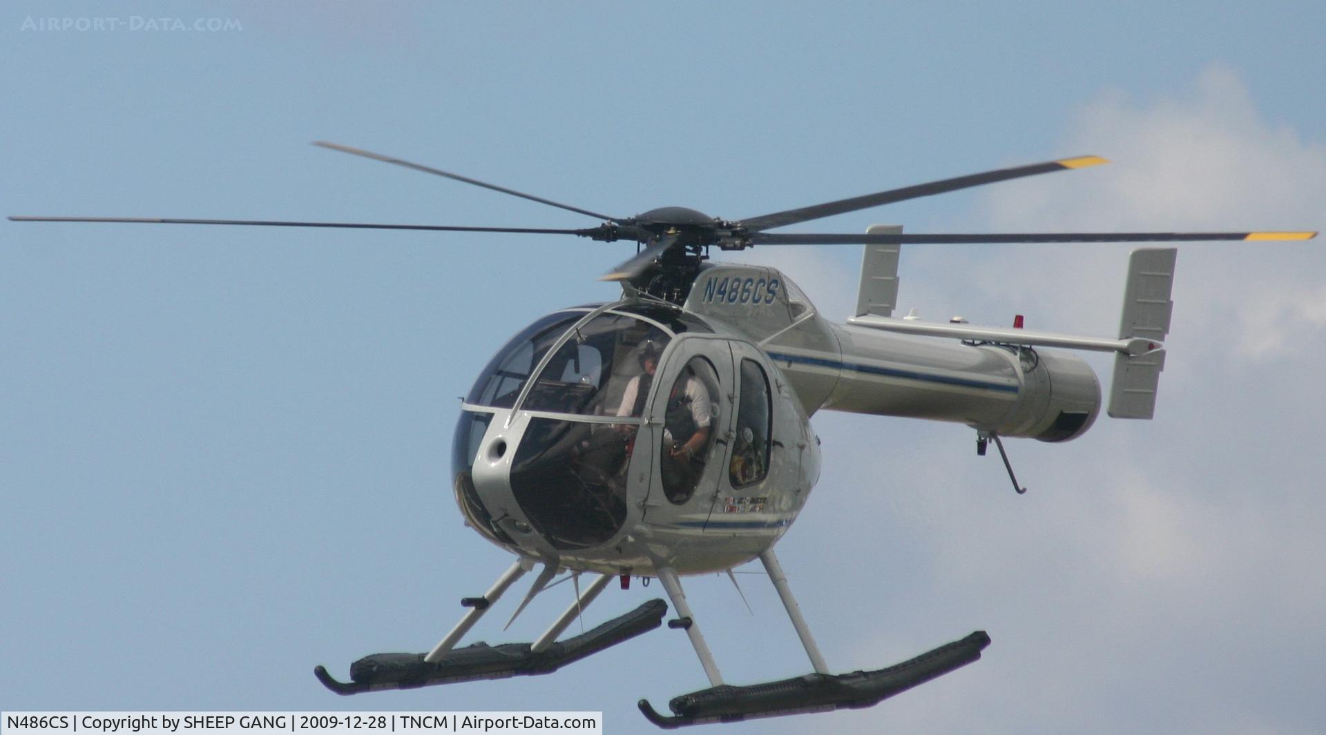 N486CS, 1997 McDonnell Douglas 500N C/N LN083, N486CS Just departed from the helipad and crossing the center line on the runway inbound to there mother ship. thats in St Barths