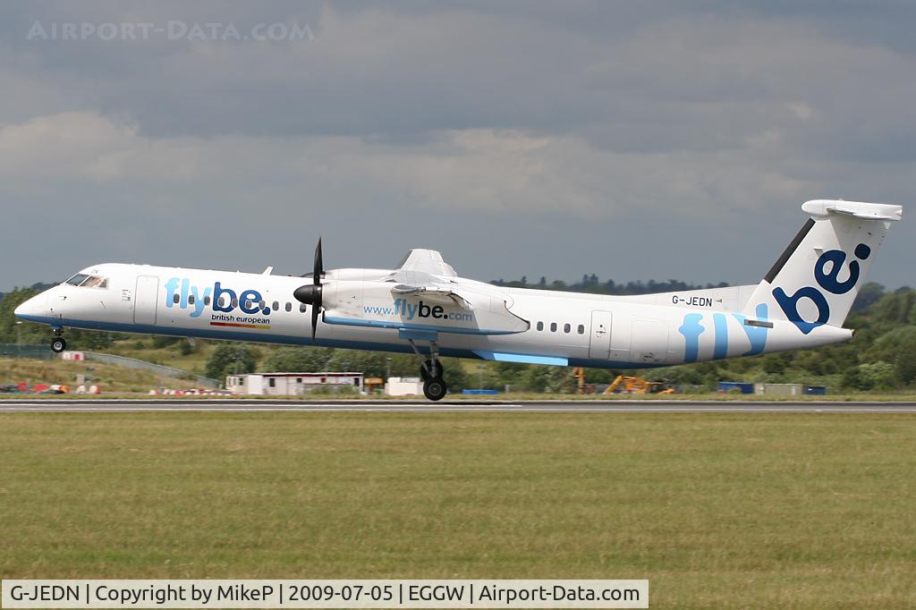 G-JEDN, 2003 De Havilland Canada DHC-8-402Q Dash 8 C/N 4078, Just about to touch wheels on Runway 26.