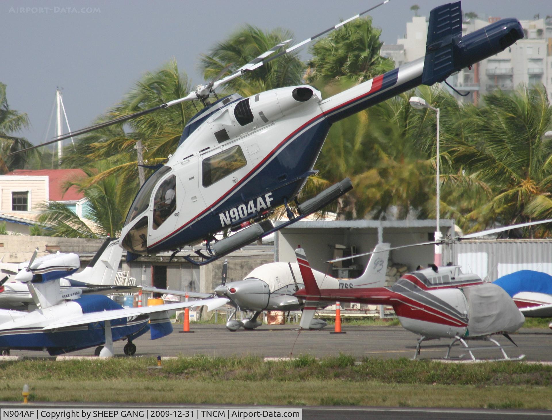 N904AF, 2001 MD Helicopters MD-900 Explorer C/N 900-00101, N904AF departing the helipad to St Barths
