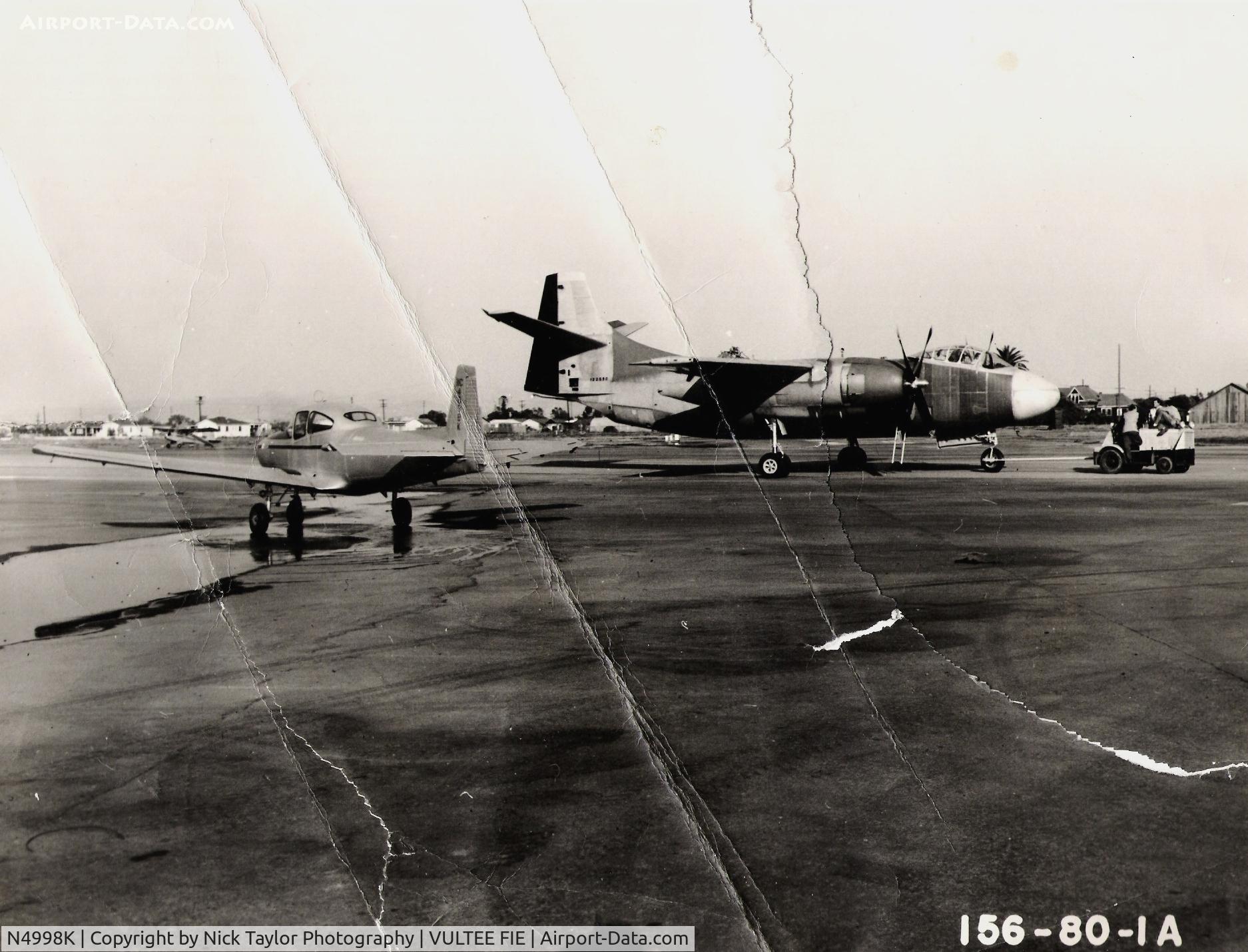N4998K, 1949 Ryan Navion A C/N NAV-4-1998, Taken at the North American plant in Downey, Ca. circa 1949. First production AJ-1 Savage in background. Crashed in 1950 (BuNo 122590). Photo courtesy of Nick Glavinich