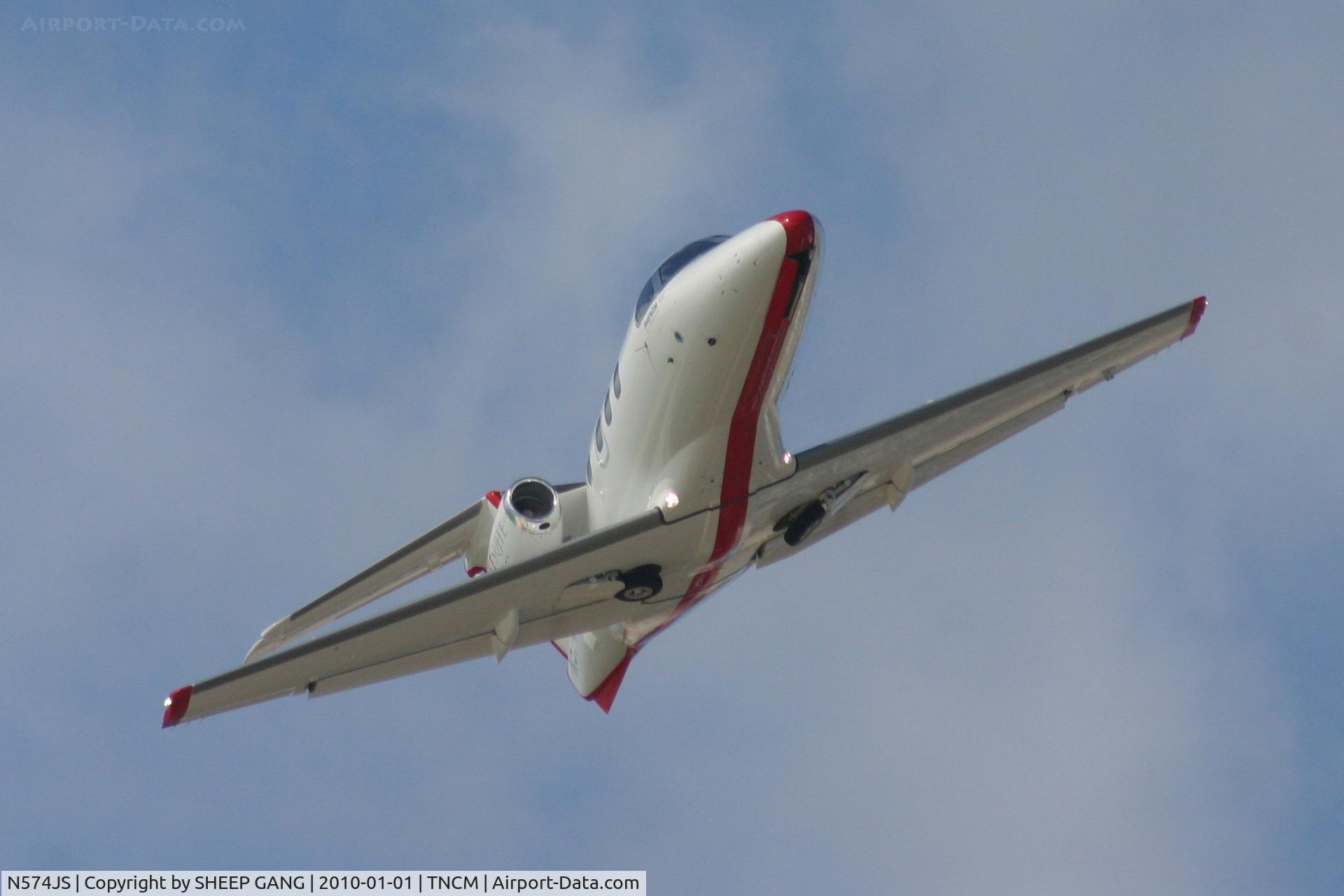 N574JS, 2009 Embraer EMB-500 Phenom 100 C/N 50000046, N574JS departing TNCM on runway 10
