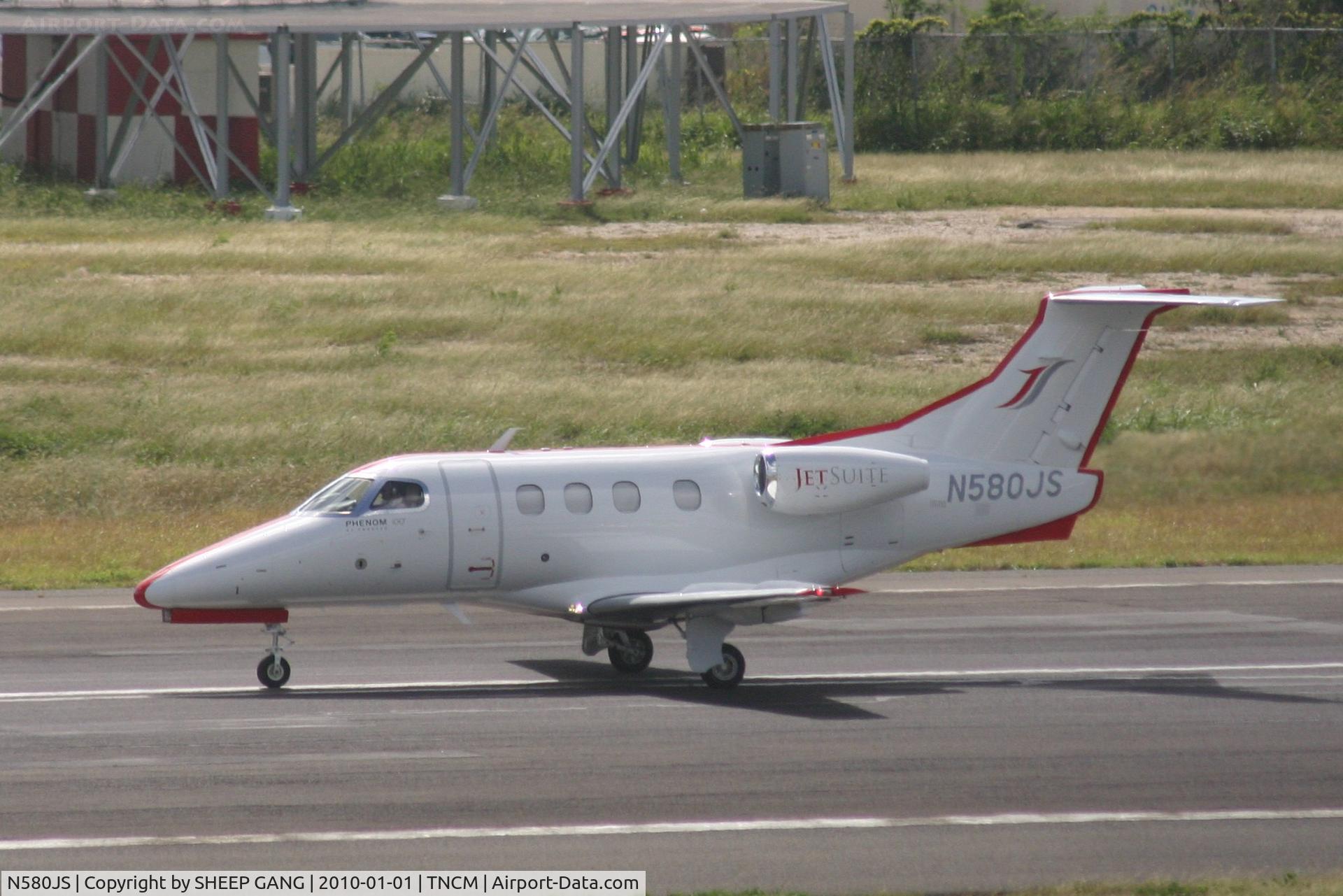 N580JS, 2009 Embraer EMB-500 Phenom 100 C/N 50000079, N580JS on the active departing TNCM