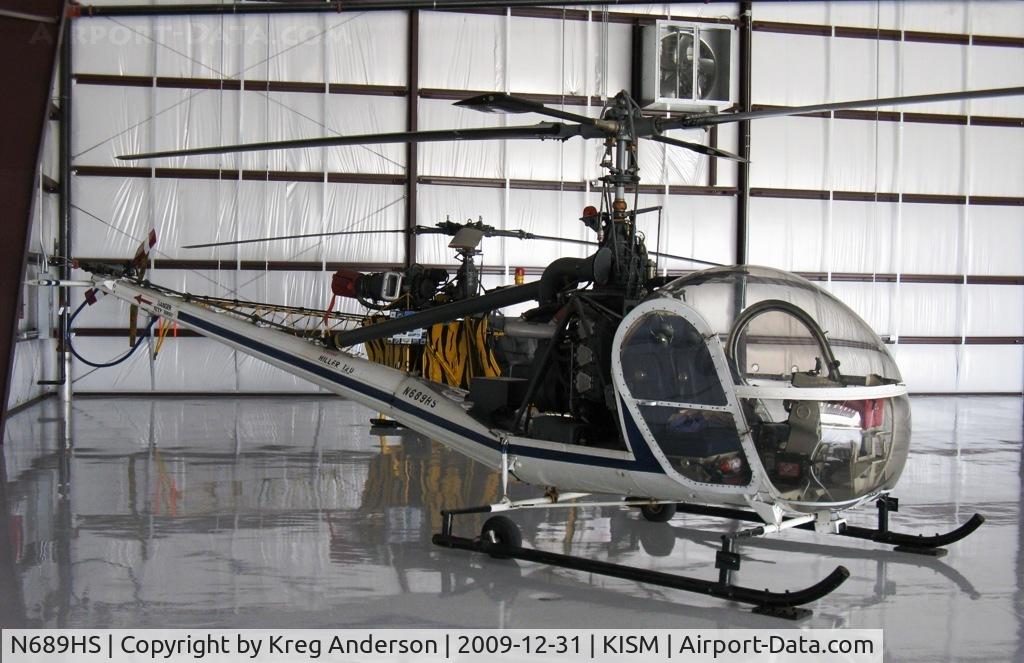 N689HS, 1959 Hiller UH-12D C/N 1169, Parked inside a hangar at the Kissimmee Air Museum.