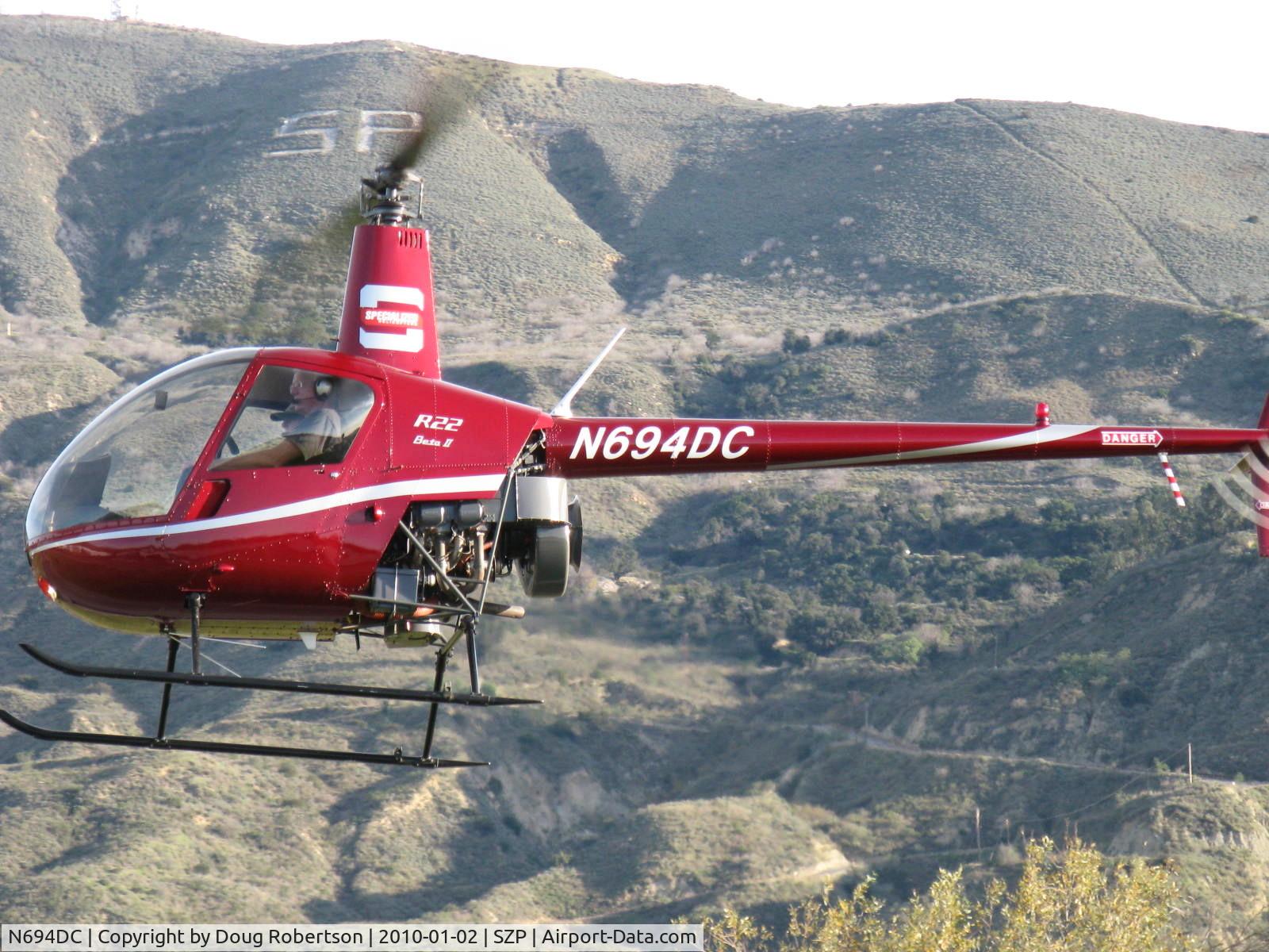 N694DC, 2004 Robinson R22 Beta C/N 3573, 2004 Robinson R22 BETA II, Lycoming O-360 derated t0 131 Hp, closeup-hover to landing, flown from left seat-more difficult. SP for Santa Paula-mark on South Mountain in background