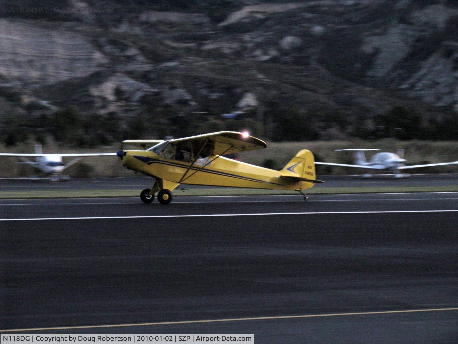 N118DG, 2008 Piper PA-18 Replica C/N 001, 2008 Ganzer XPA18, Continental O-200-A 100 Hp, landing roll Rwy 04 in twilight-last possible good photo
