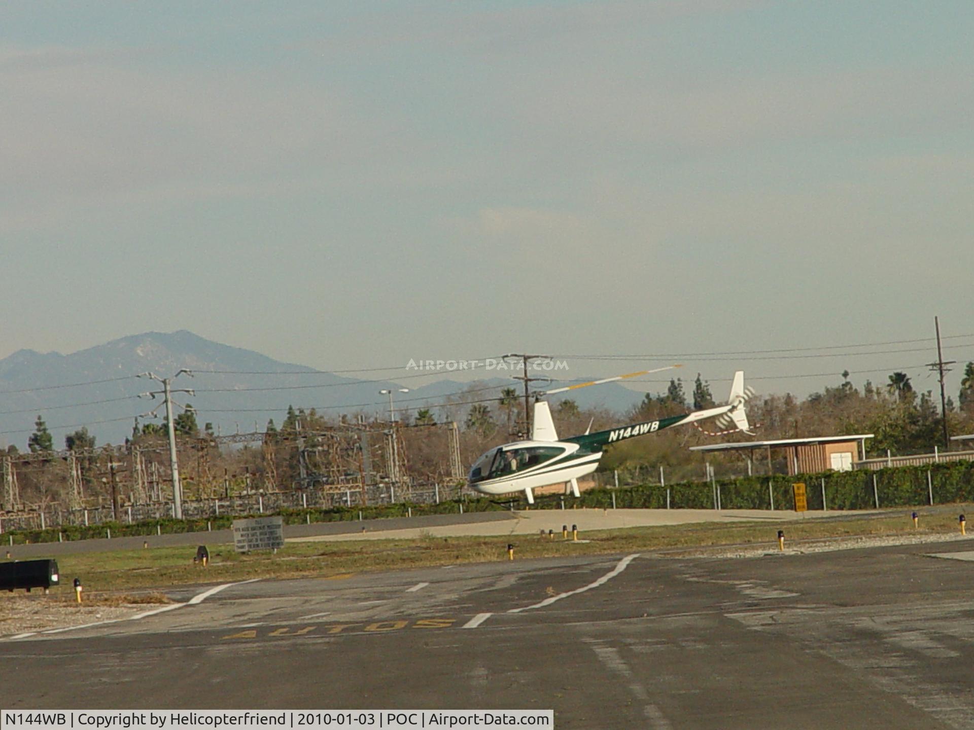 N144WB, 1998 Robinson R44 C/N 0545, Air taxiing to runway 26L for take off