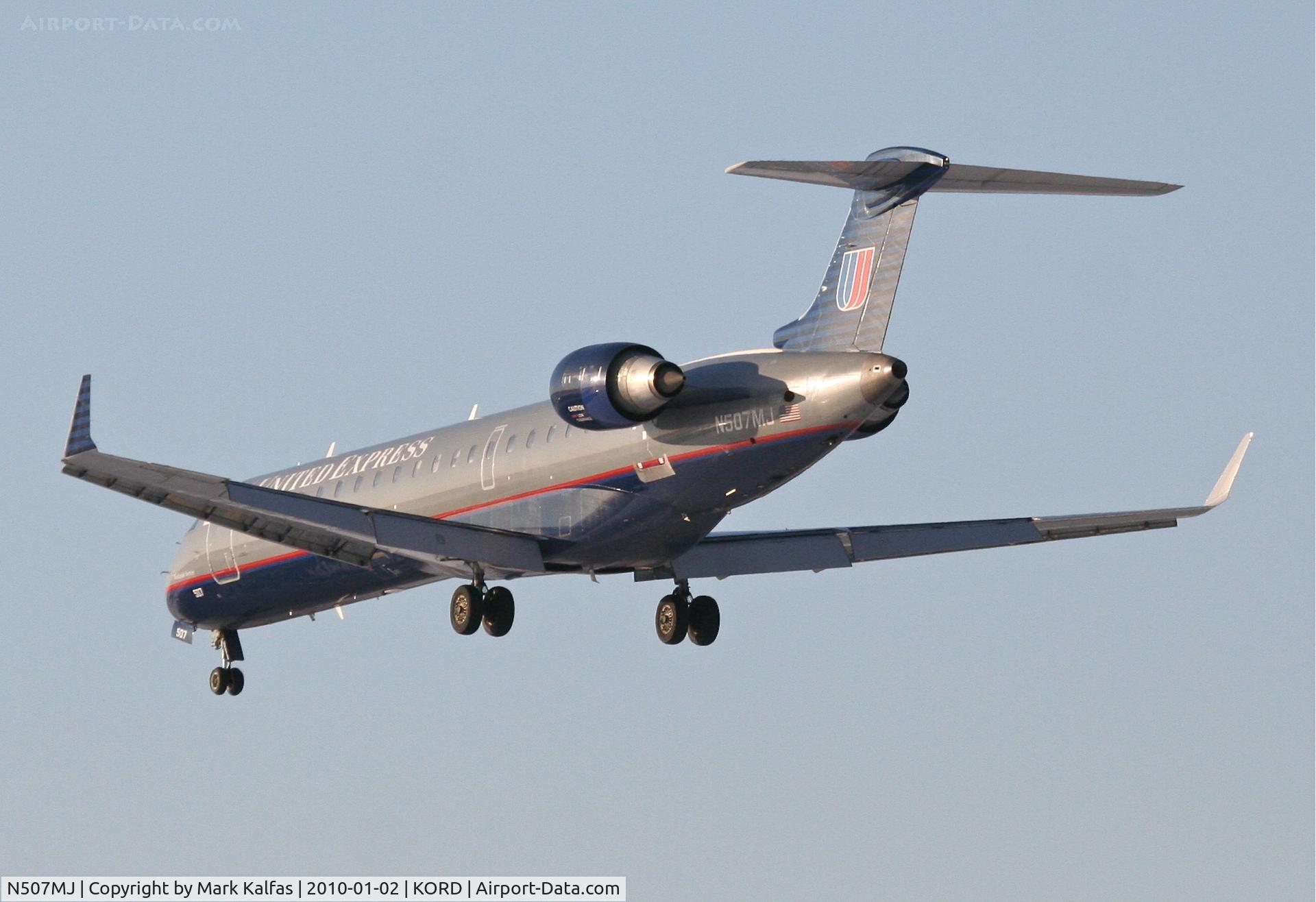 N507MJ, 2003 Bombardier CRJ-701 (CL-600-2C10) Regional Jet C/N 10017, Mesa Airlines/United Express CRJ7, ASH7117, arrives KORD RWY 28 from KCOS.