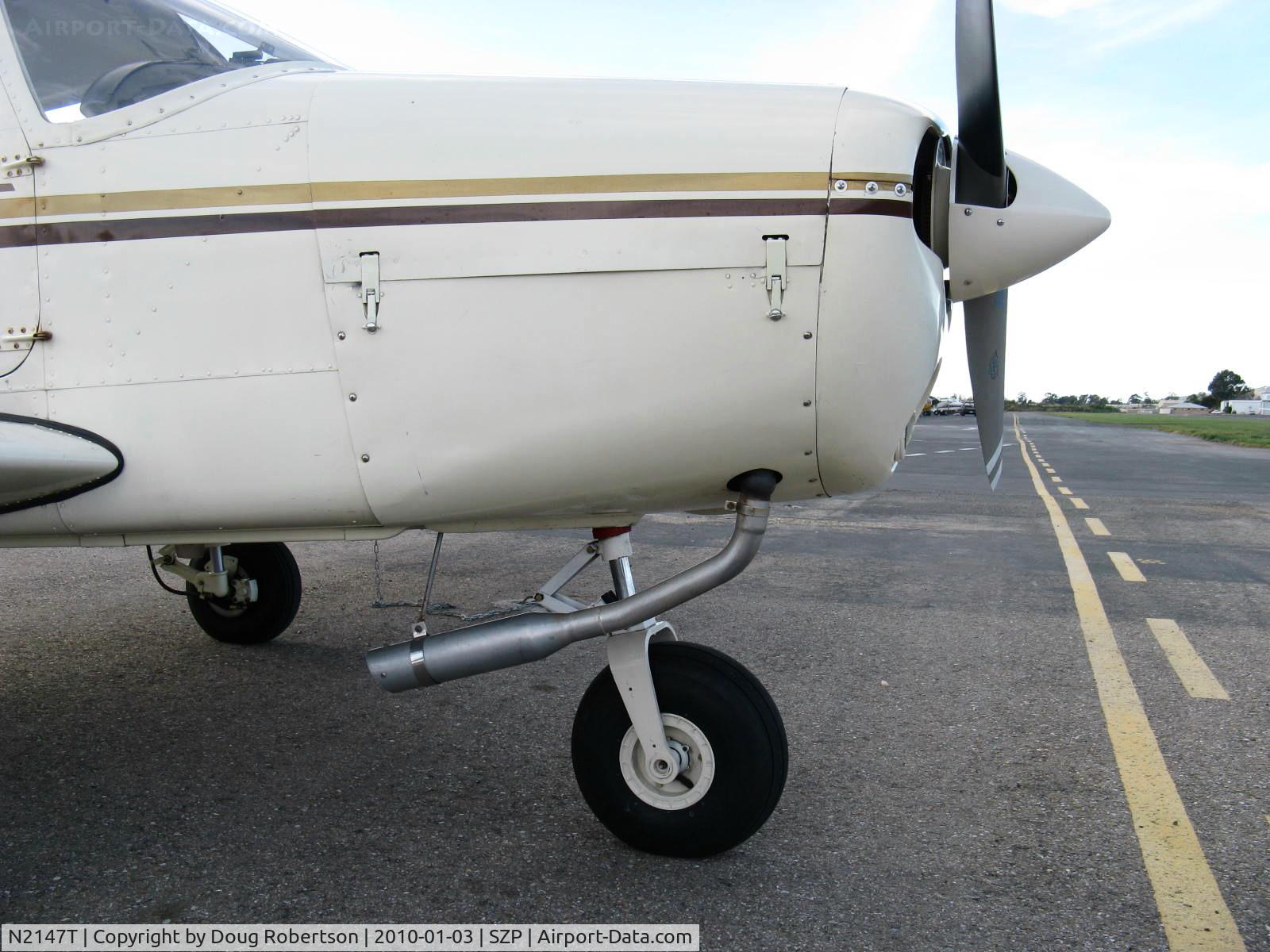 N2147T, 1971 Piper PA-28-140 C/N 28-7125547, 1971 Piper PA-28-140, Lycoming O-320-E2A 150 Hp, closeup of Power Flow exhaust mod STC'd.
