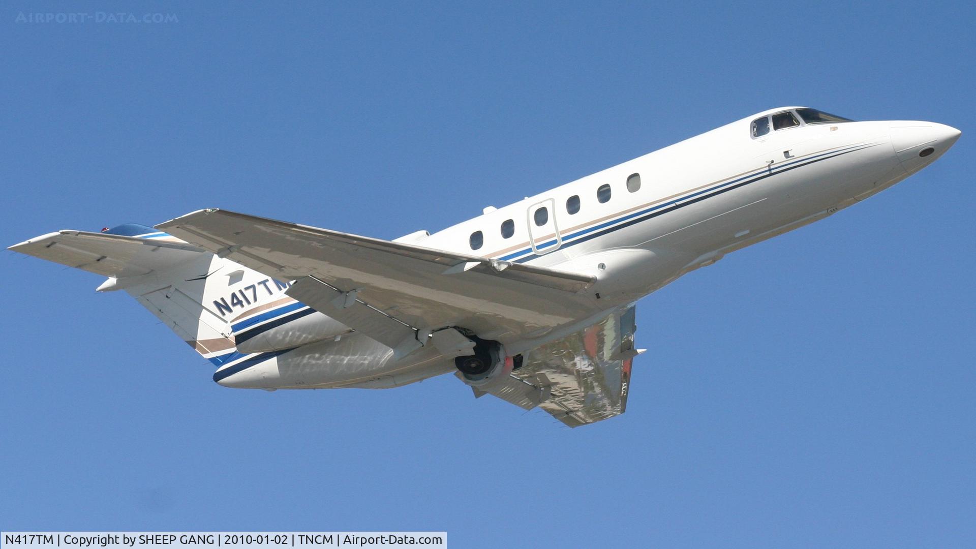 N417TM, 2004 Raytheon Hawker 800XP C/N 258657, N417TM departing TNCM runway 10 and a nother close up