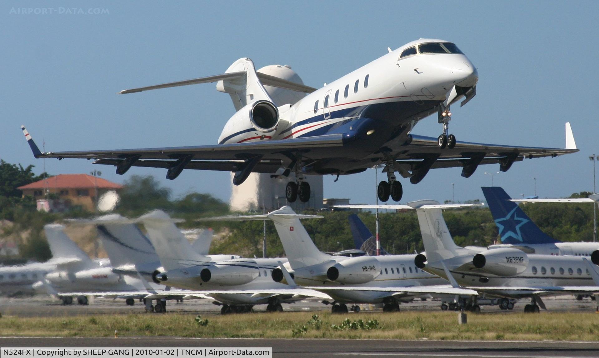 N524FX, 2006 Bombardier Challenger 300 (BD-100-1A10) C/N 20095, N524FX departing TNCM