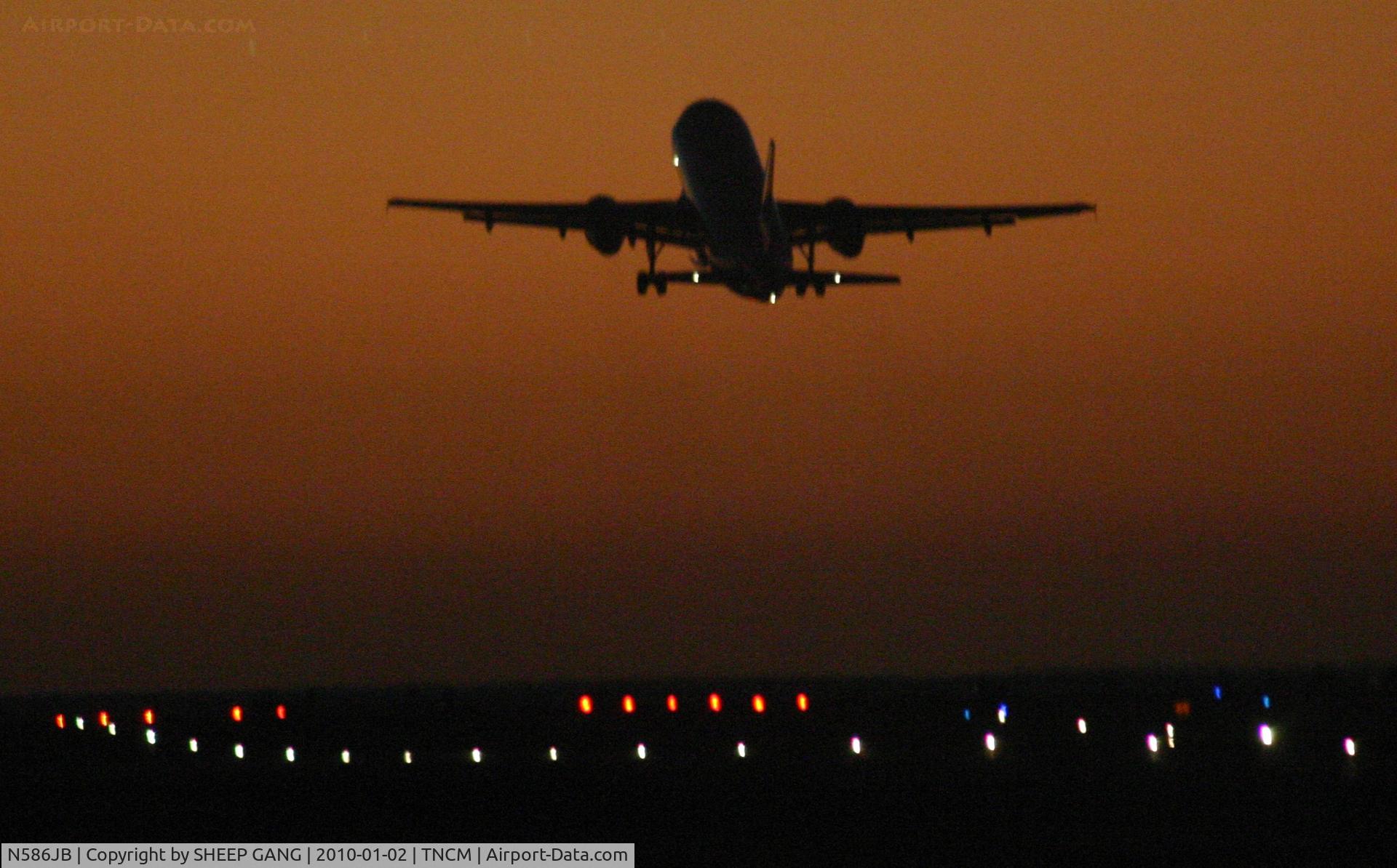 N586JB, 2004 Airbus A320-232 C/N 2160, Jet Blue N586JB departing TNCM on runway 28 into the sunset