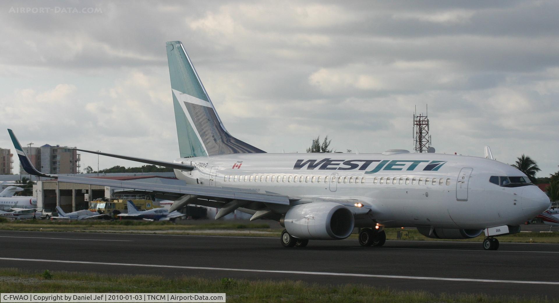 C-FWAO, 2002 Boeing 737-7CT C/N 33657, Westjet C-FWAO landing at TNCM