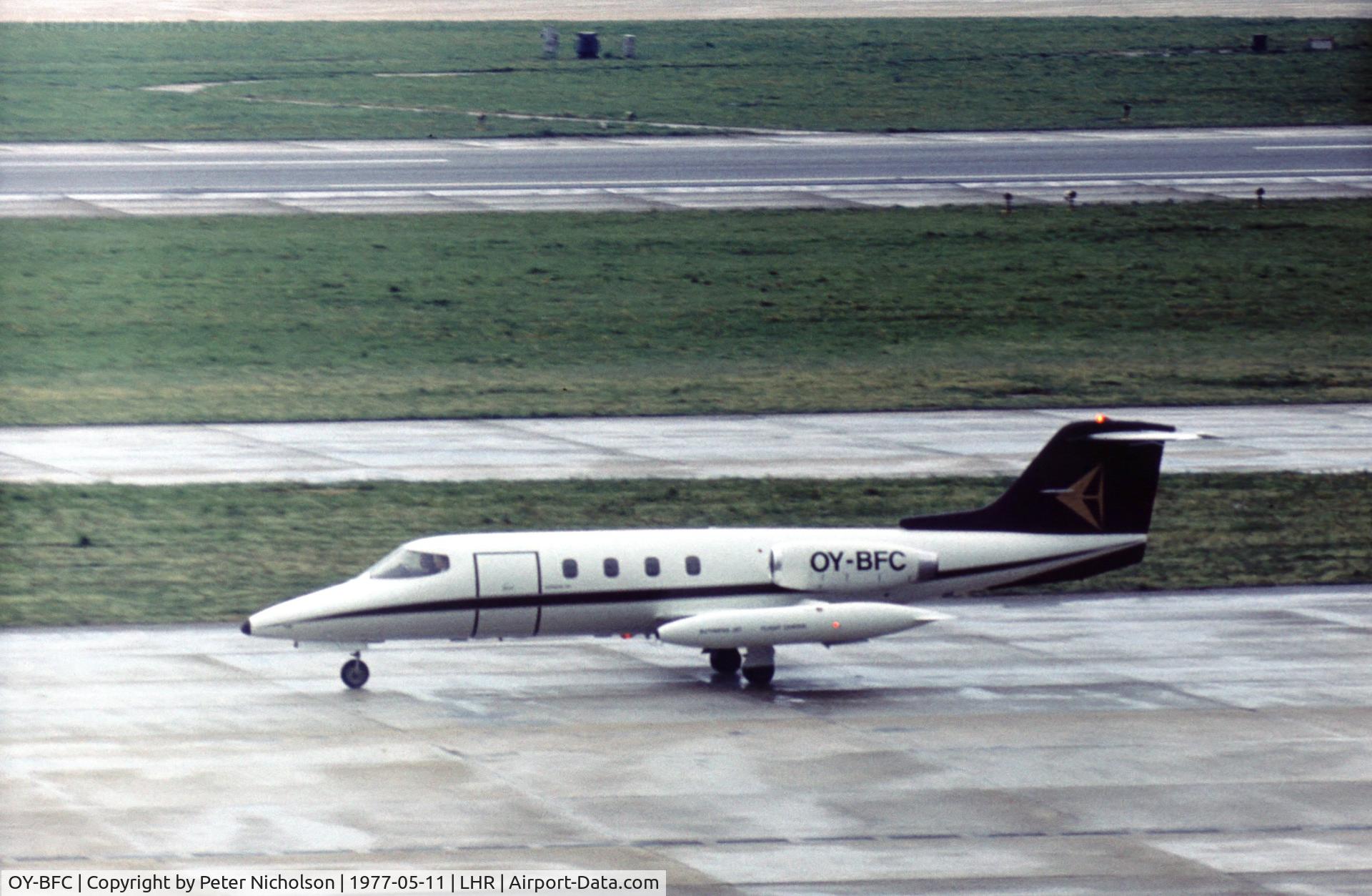 OY-BFC, 1973 Gates Learjet 25B C/N 112, Learjet 25B of Business Aviation taxying to the executive terminal at Heathrow in May 1977.