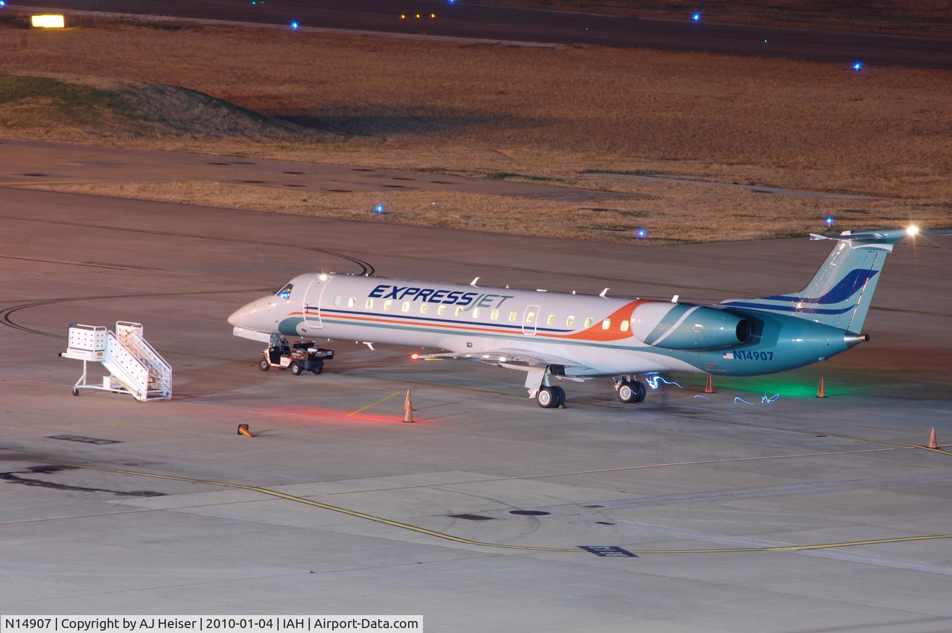 N14907, 2001 Embraer ERJ-145LR (EMB-145LR) C/N 145468, N14907, with brand new charter livery, parked at northside Term C ramp
