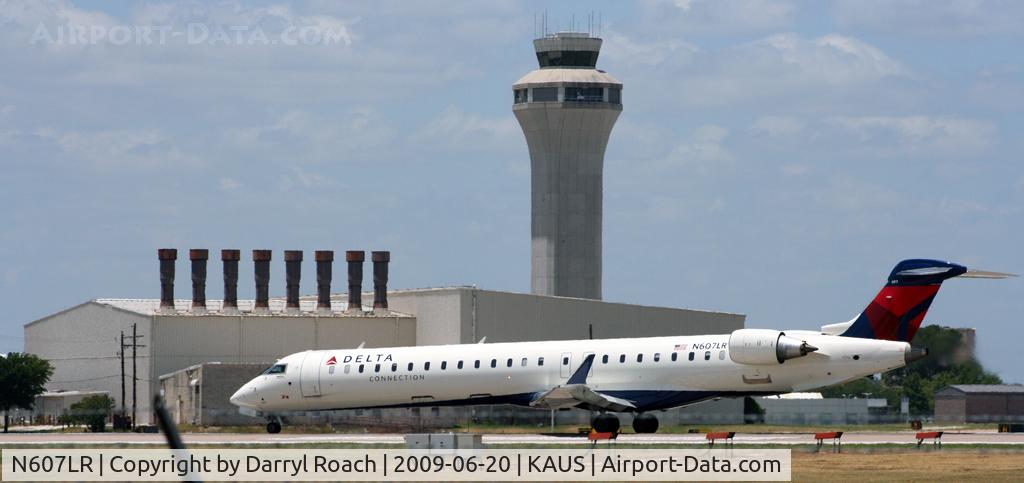 N607LR, 2008 Bombardier CRJ-900ER (CL-600-2D24) C/N 15178, DALX departs 17L with a beautiful backdrop of the Tower.