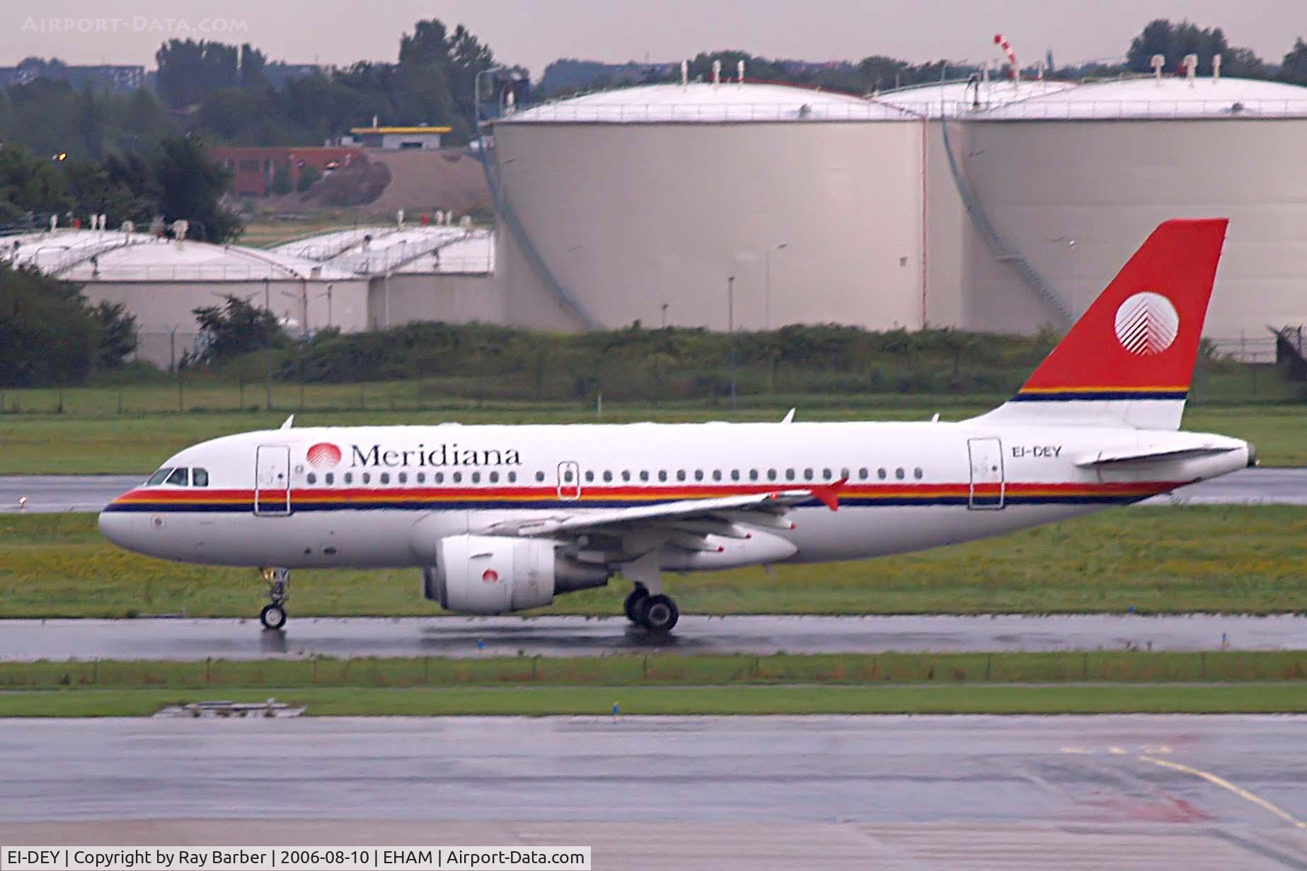 EI-DEY, 1999 Airbus A319-112 C/N 1102, Airbus A319-112 [1102] (Meridiana) Schiphol~PH 11/08/2006. Meridiana Airbus seen taxiing out for departure in pouring rain.