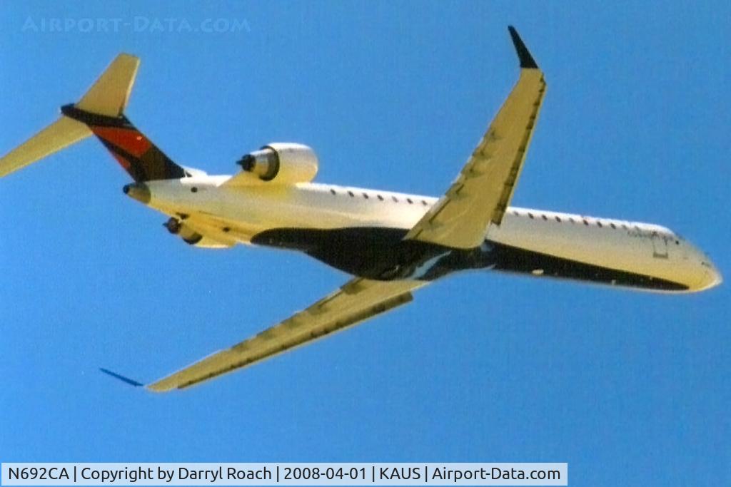 N692CA, 2006 Bombardier CRJ-900ER (CL-600-2D24) C/N 15092, DALX departs 35R.