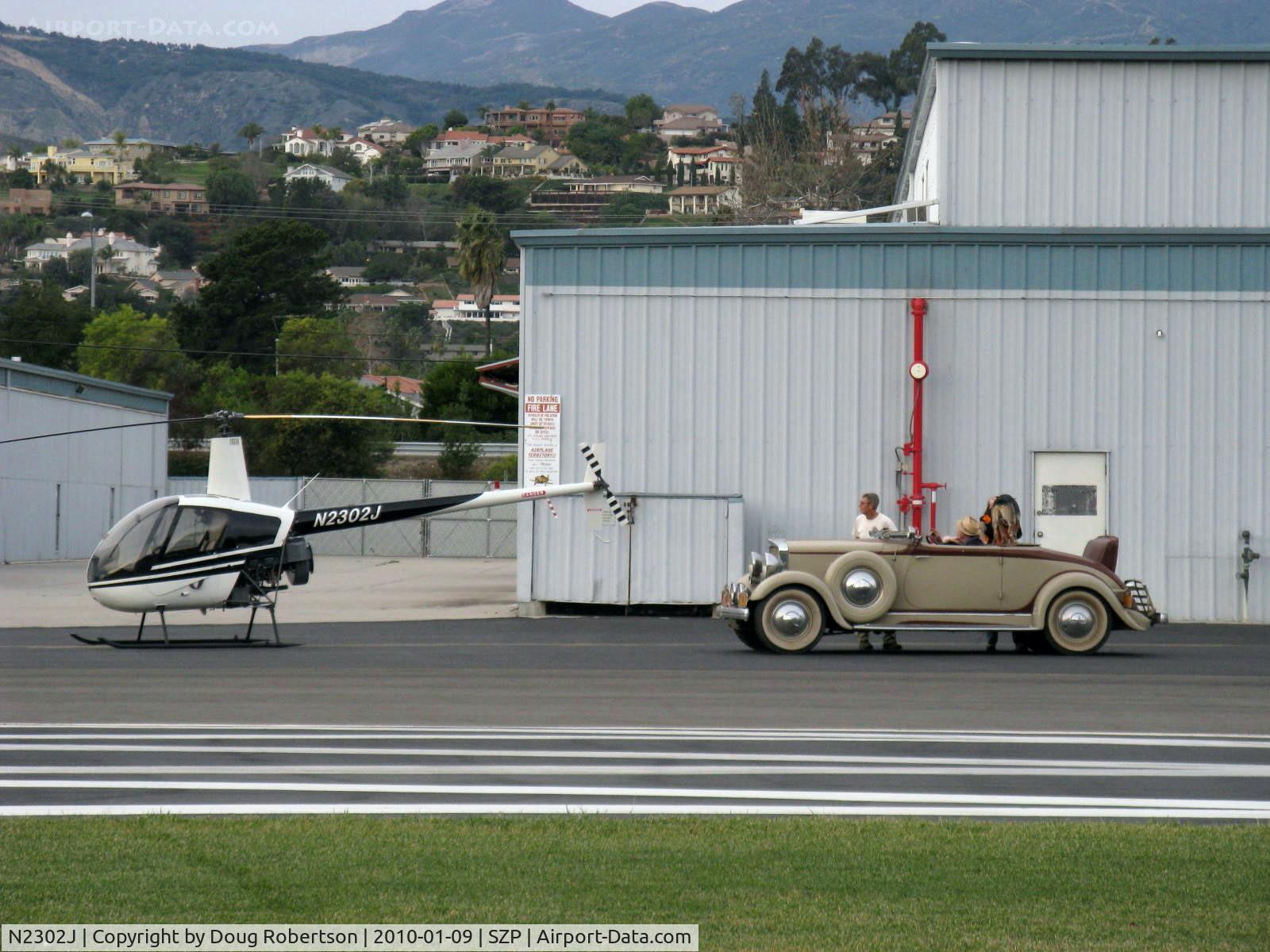 N2302J, 1946 Robinson R22 Beta C/N 1946, 1946 (sic) Robinson R22 BETA, Lycoming O-320, contrasting transportation modes