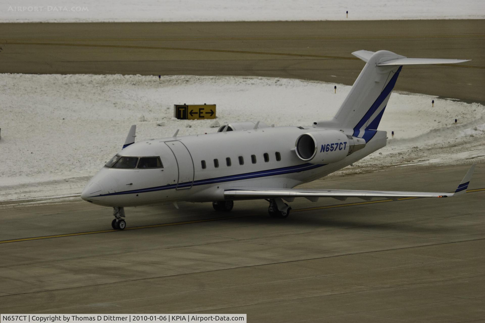 N657CT, 2006 Bombardier Challenger 604 (CL-600-2B16) C/N 5665, N657CT taxies on the South Commercial Ramp