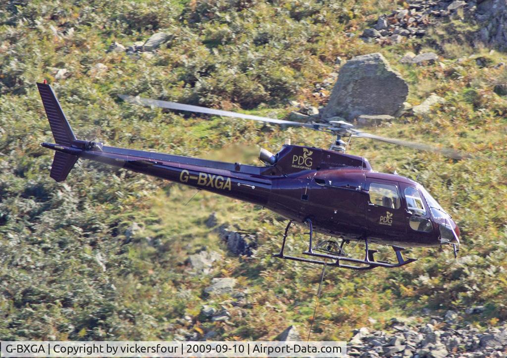 G-BXGA, 1991 Aerospatiale AS-350B-2 Ecureuil C/N 2493, PLM Dollar Group. Operating in Dunmail Raise, lifting rocks for the National Parks for pathway maintenance.
