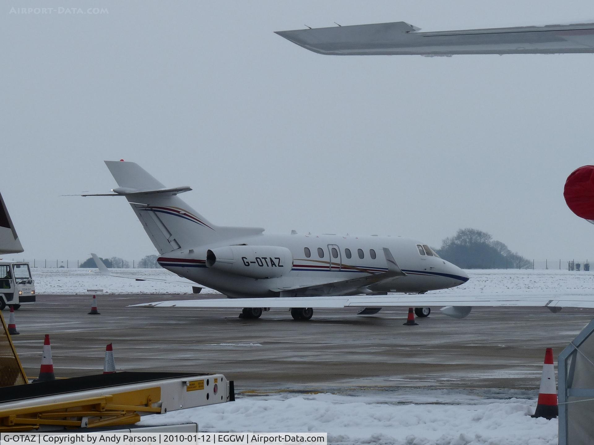G-OTAZ, 2009 Hawker Beechcraft 900XP C/N HA-0112, Parked in amongst the biz jets at Luton