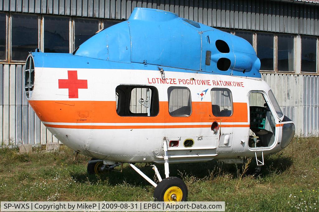 SP-WXS, Mil Mi-2 Hoplite C/N 513906015, WFU near the Polish Air Rescue hangar.