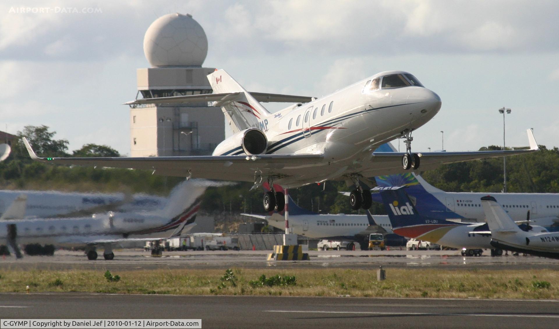 C-GYMP, 2010 Embraer EMB-500 Phenom 100 C/N 50000214, C-GYMP departing TNCM on runway 10