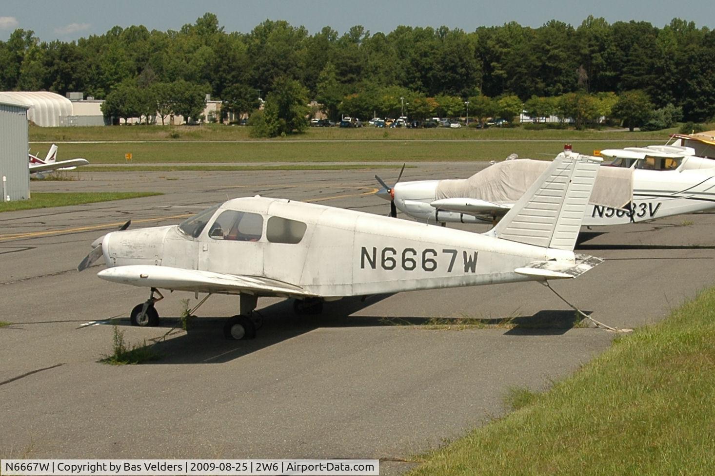 N6667W, 1965 Piper PA-28-140 C/N 28-20771, Looking dirty at St. Mary's.