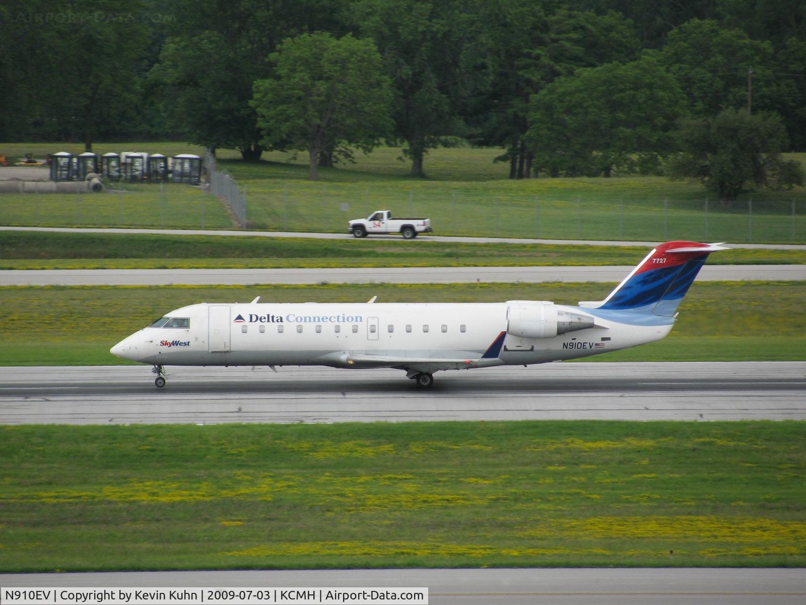 N910EV, 2002 Bombardier CRJ-200ER (CL-600-2B19) C/N 7727, Guy in the truck must have a pretty good view!