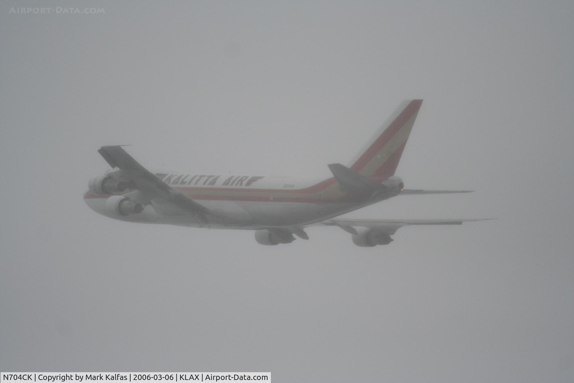 N704CK, 1980 Boeing 747-209F C/N 22299, Kalitta Air Boeing 747-209F, blasting through the fog, 25L departure KLAX.