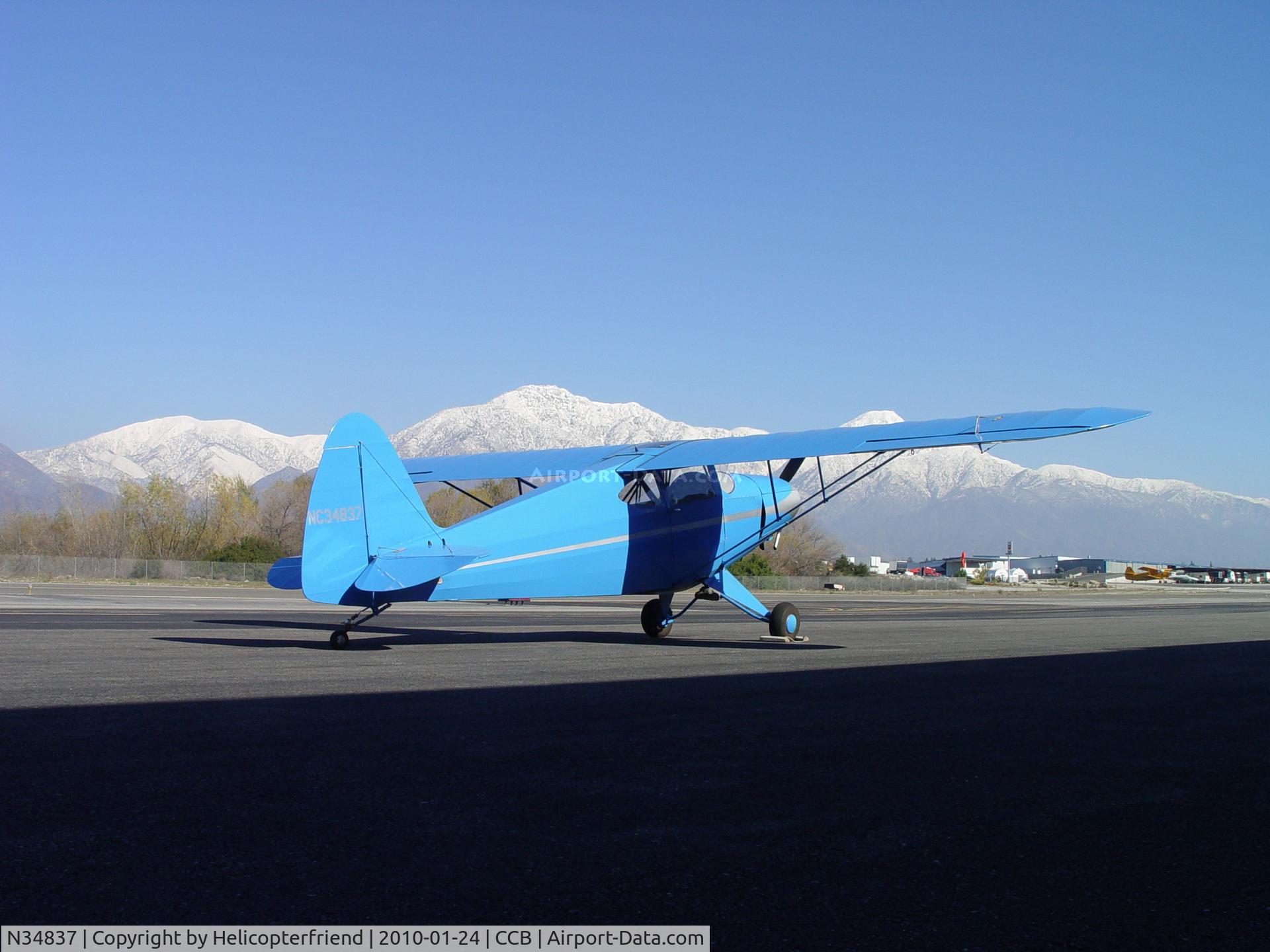 N34837, 1941 Porterfield 75C C/N 1657, Parked south of the snowy mountains at Cable Airport
