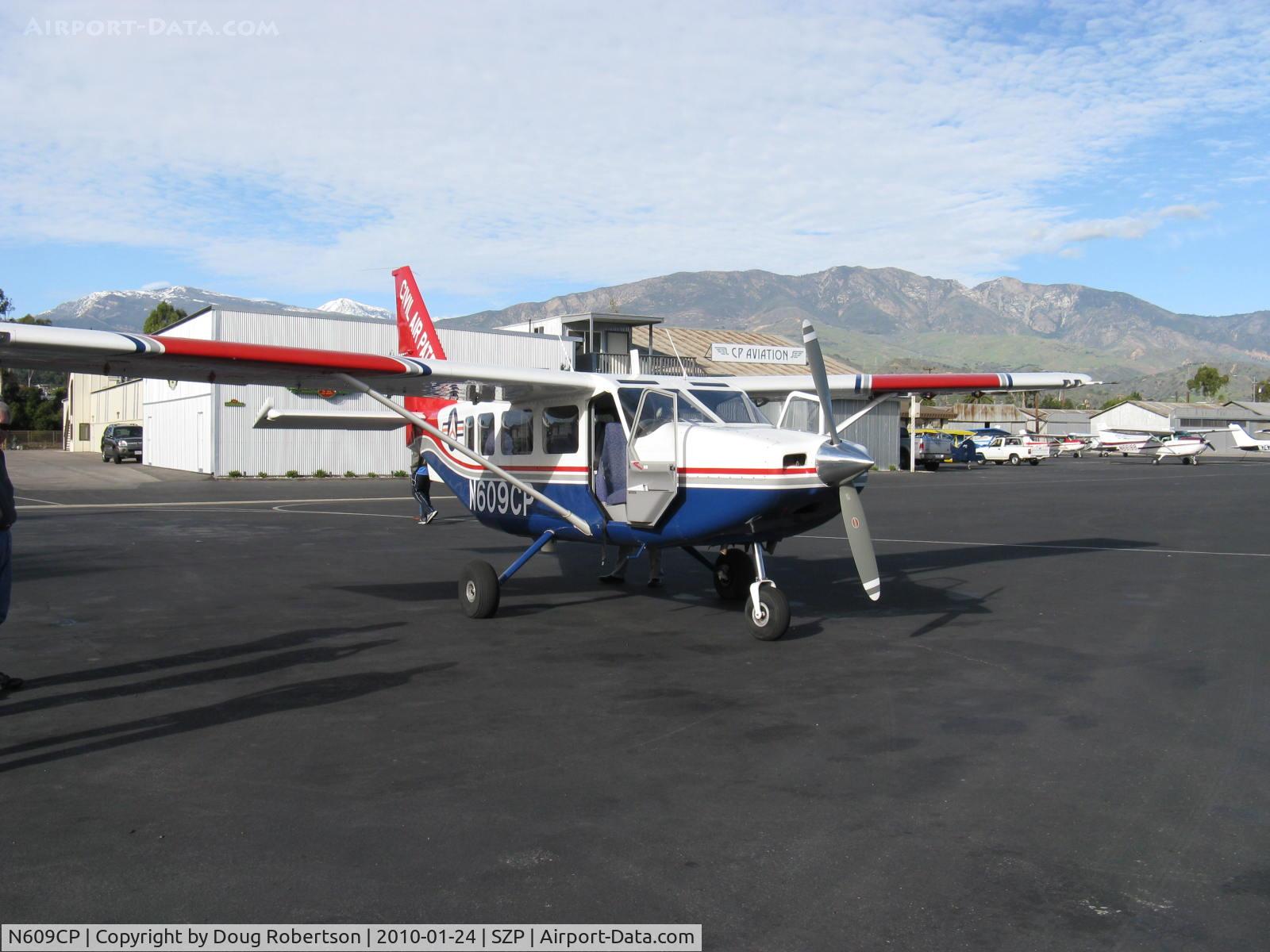 N609CP, Gippsland GA-8 Airvan C/N GA8-04-054, 2004 Gippsland Aeronautics GA-8 AIRVAN, ex-VH-UGR, Lycoming IO-540-K1AS 300 Hp for 2 minutes, 8 place with two seats removed for sensor equipment, operated by Civil Air Patrol at VNY, refueling. Note: Snow-capped 6,704' Hines Peak in the Topa Topa Mntns.