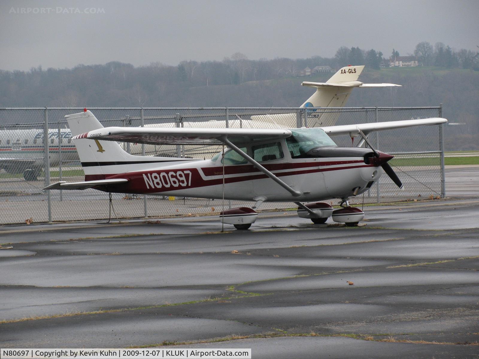 N80697, 1976 Cessna 172M C/N 17266705, A Lunken resident with an exotic visitor behind.